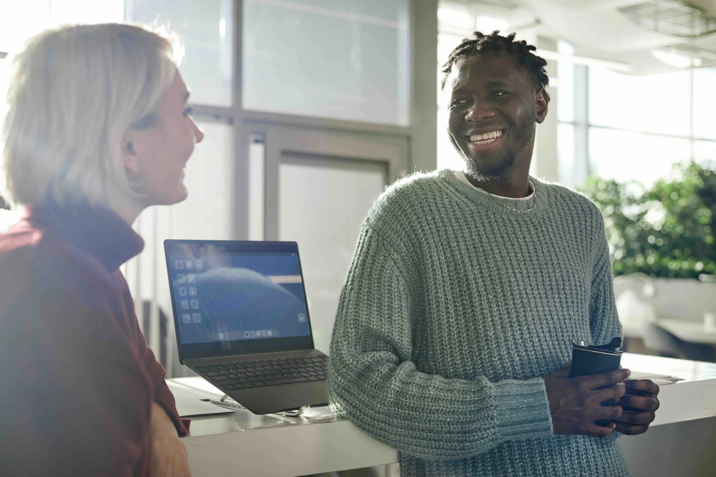 Two people in discussion at work