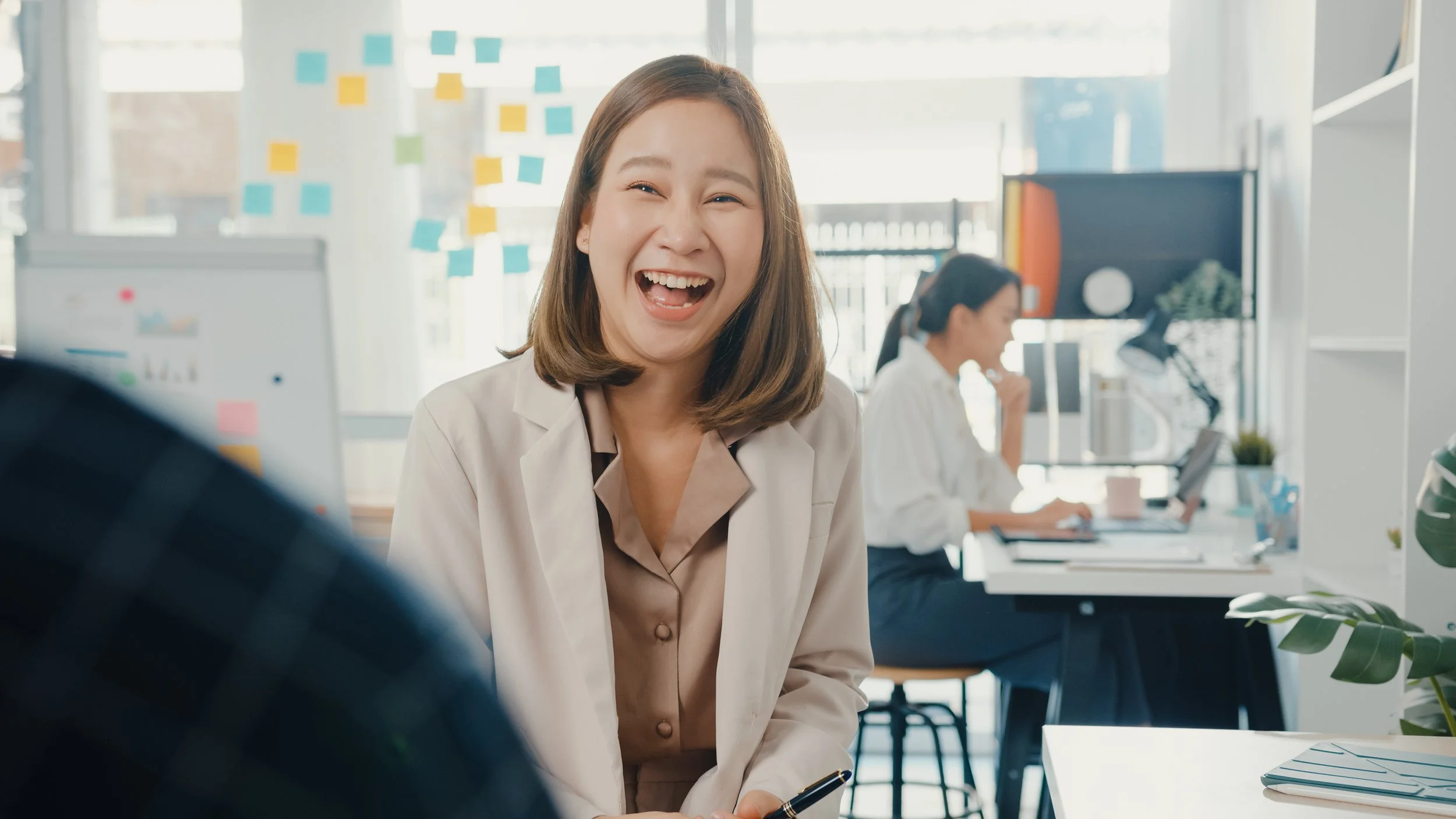 Women in conversation in office