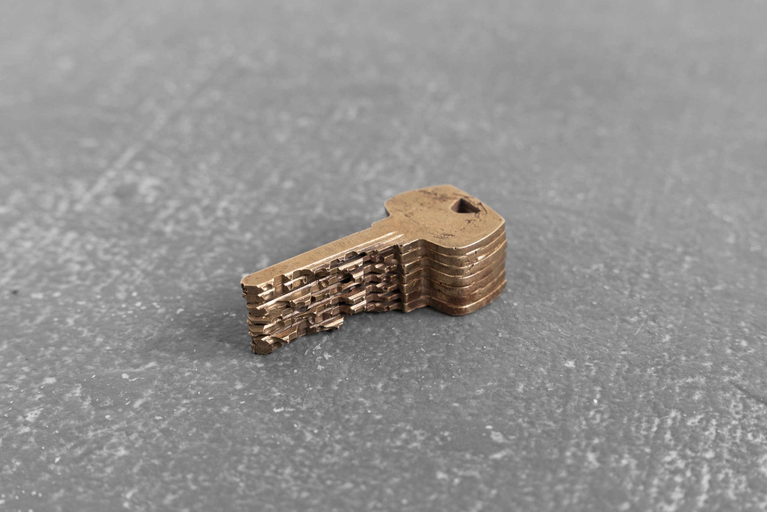 All of the keys I’ve been issued that I have no use for. bronze, cherry wood 
2.25" x 1"  x 0.75"