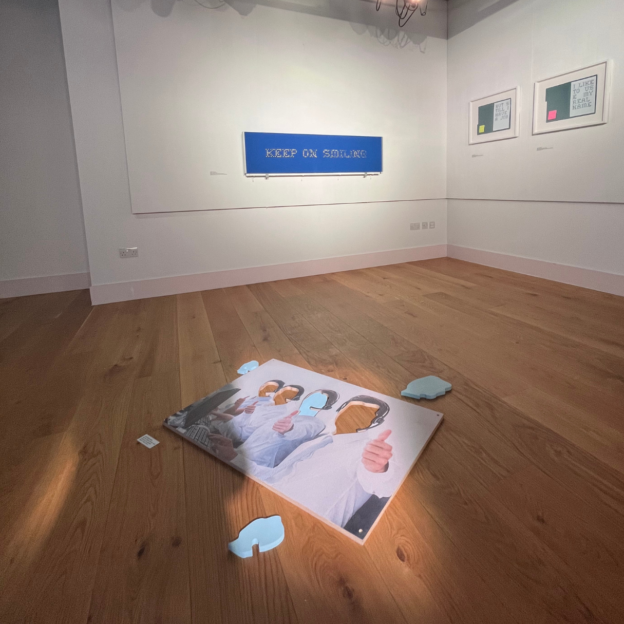 José García Oliva - How May I Serve You?  2019 - 2023, which comprises the pieces: Keep on Smiling, 2022 ; We Use English Names, 2022 ; But S(Till) I Have A Job,  2022; Like to Us(E) My Real Name,  2022 - These artworks were part of a larger project 