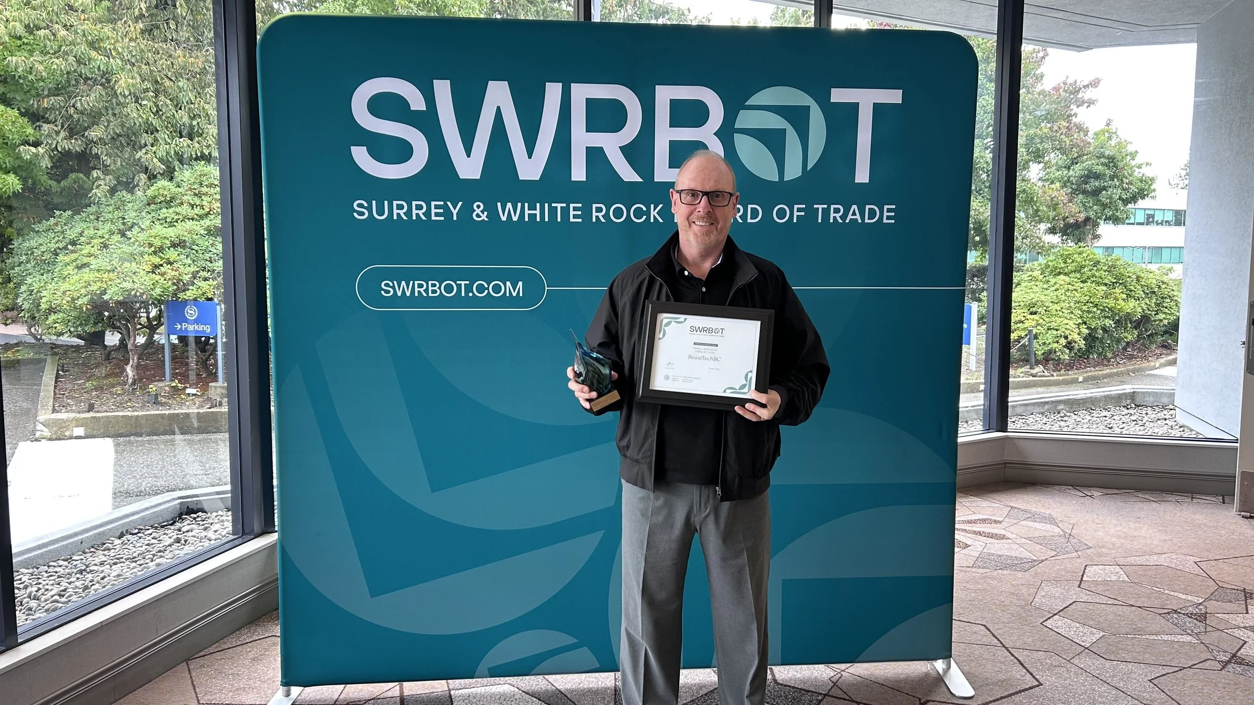 Board director Mark Taylor accepts the SWRBOT Environment & Business award in the Small Business category.