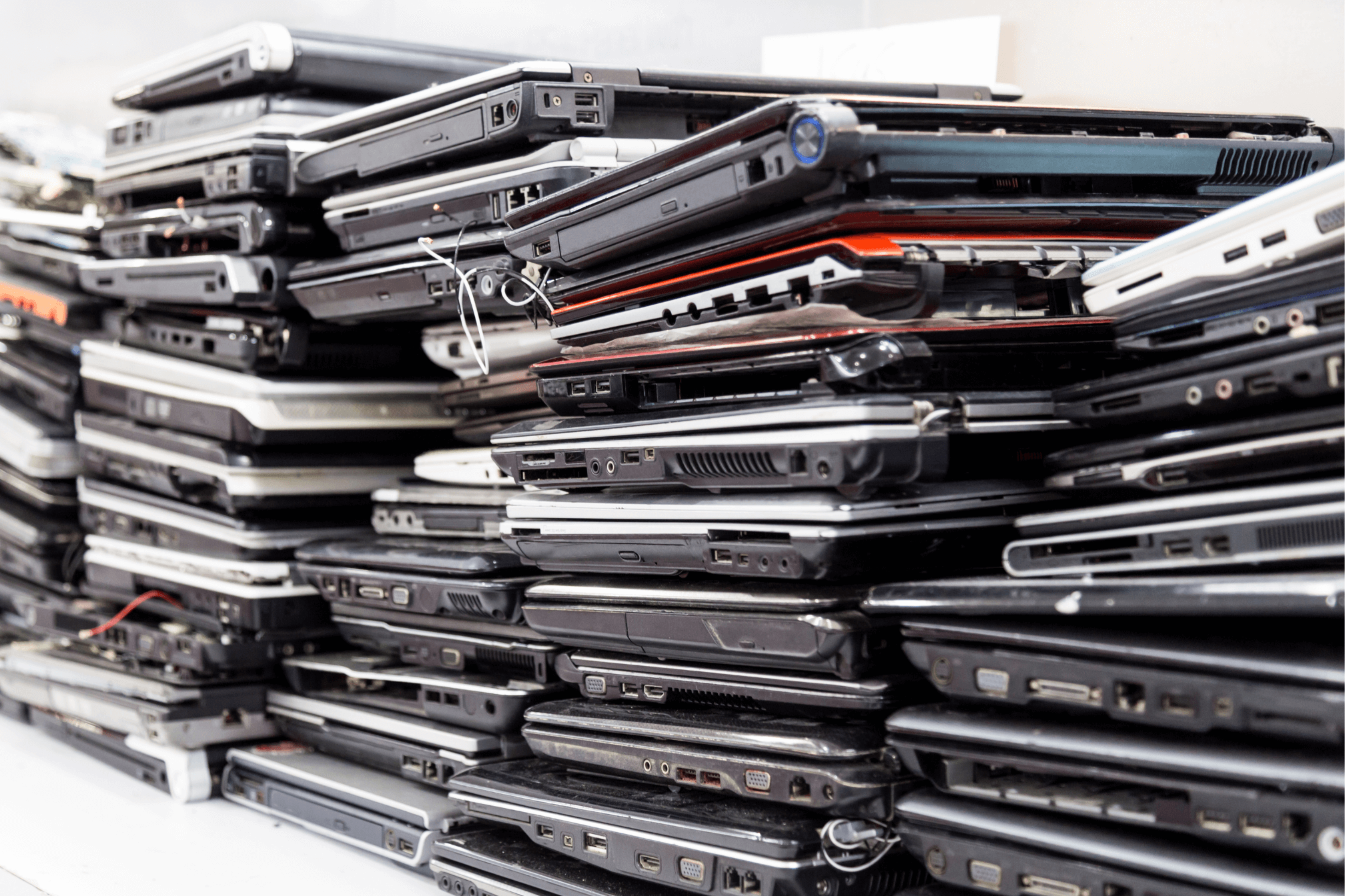 pile of laptops.png