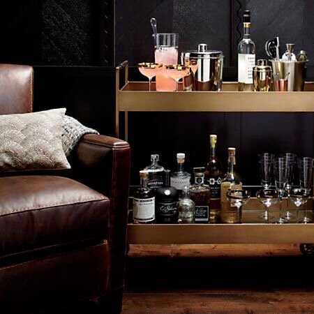  The Libations Bar Cart from  Crate &amp; Barrel  is chic and transitional. It plays well with fragile bar items and heftier collections like books. 