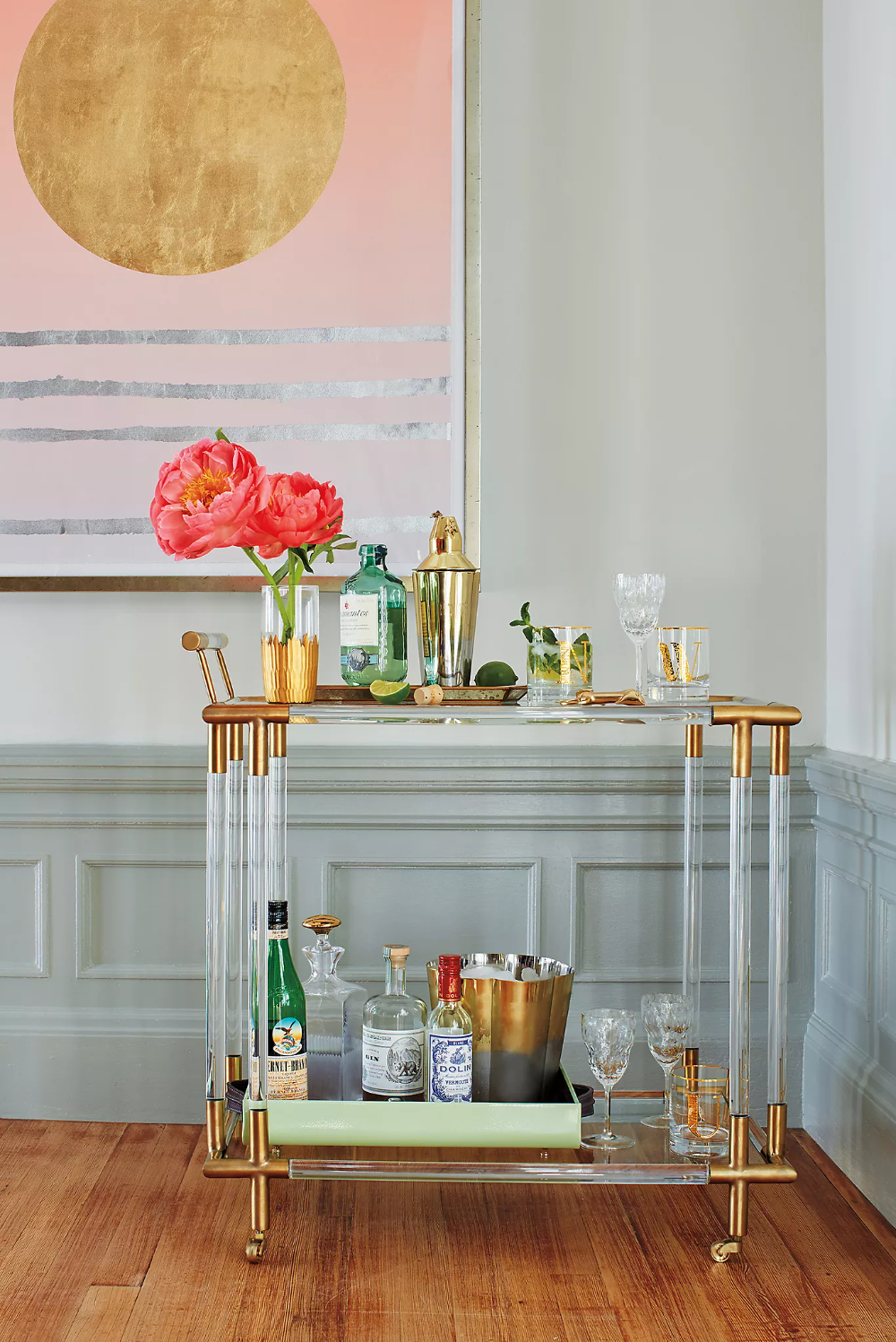  If you want to get really fancy, go with the Oscarine Lucite and Gold Bar Cart from  Anthropologie . There’s no denying the glitz and glamour of this piece which functions as a bar cart, but looks more like a high end sculpture. 