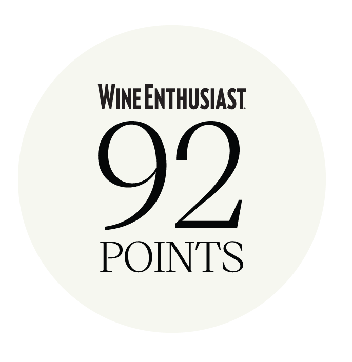 A circular badge with a white background and black text that reads 'Wine Enthusiast 92 Points'.