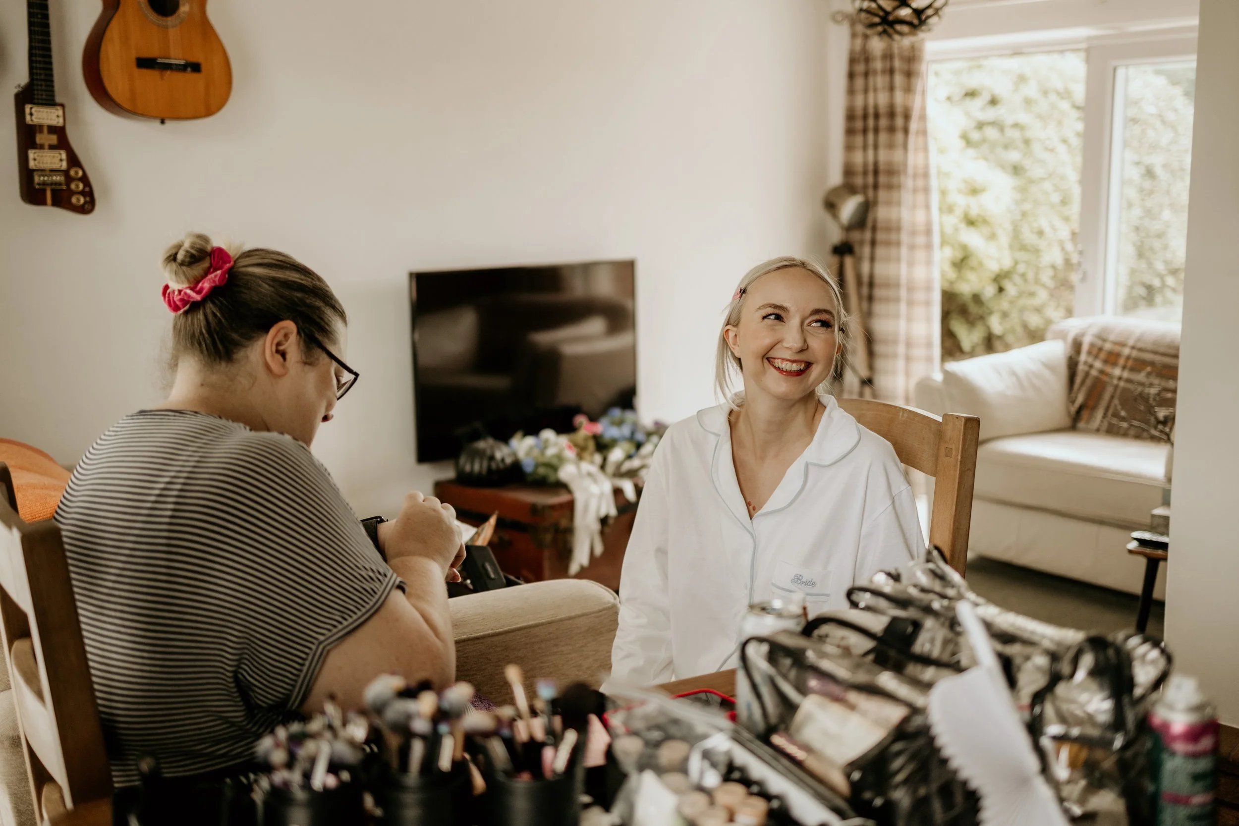 A relaxed wedding morning of the bride getting ready smiling