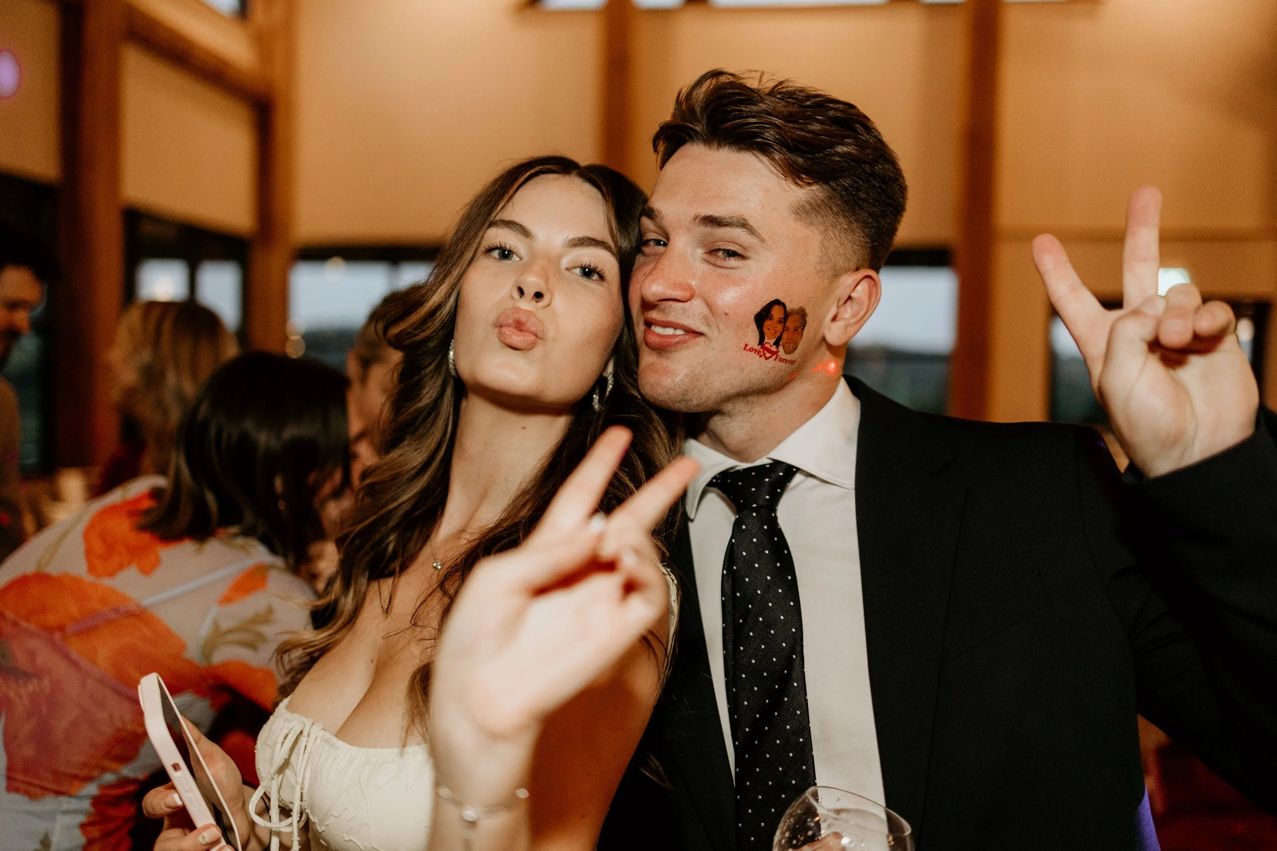 Relaxed wedding photography of guests posing
