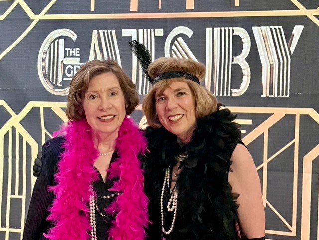 Two flappers are out on a lark— Nan Nelson and Linda Bartling, co-presidents of FRIENDS.