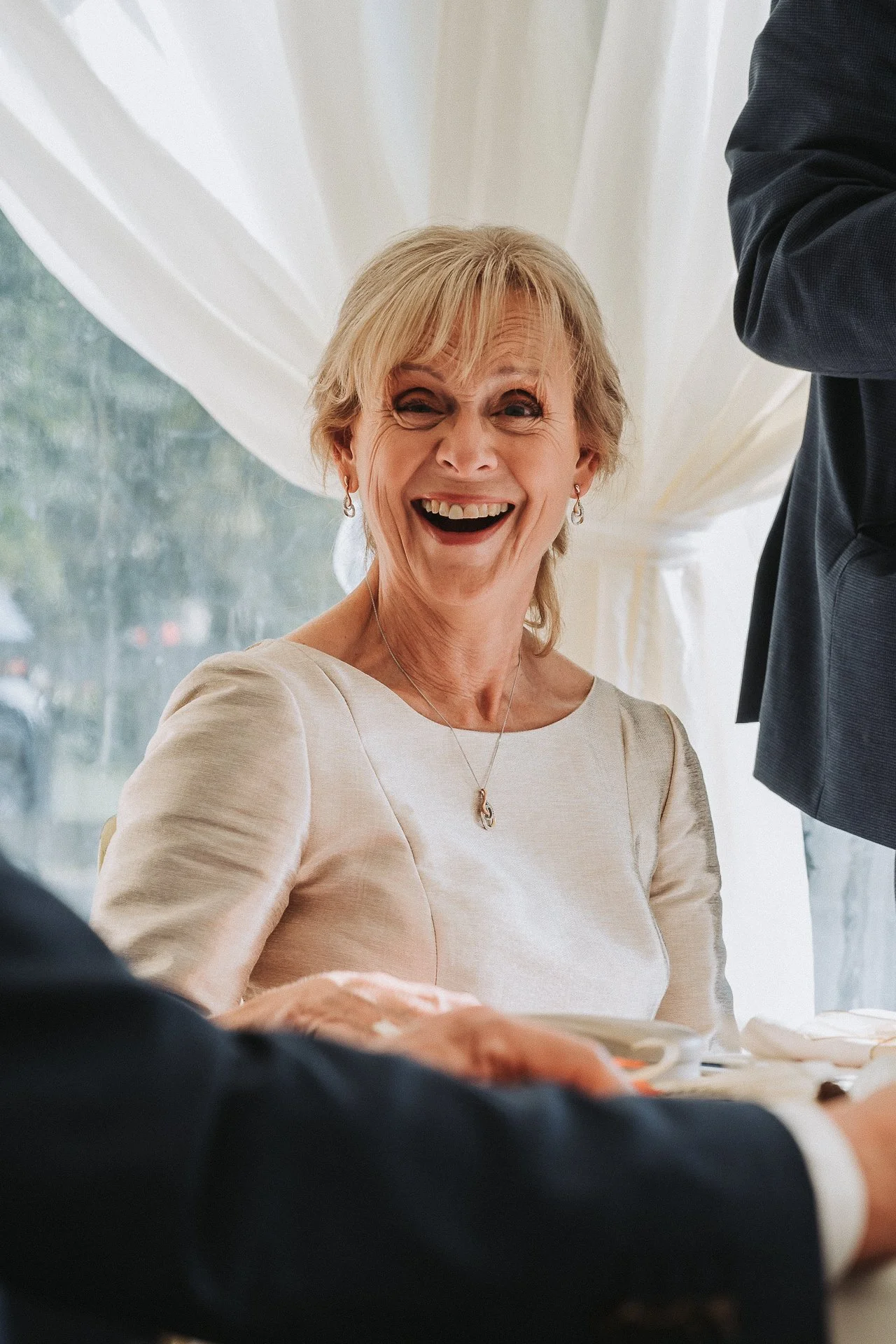 Bride laughing during wedding
