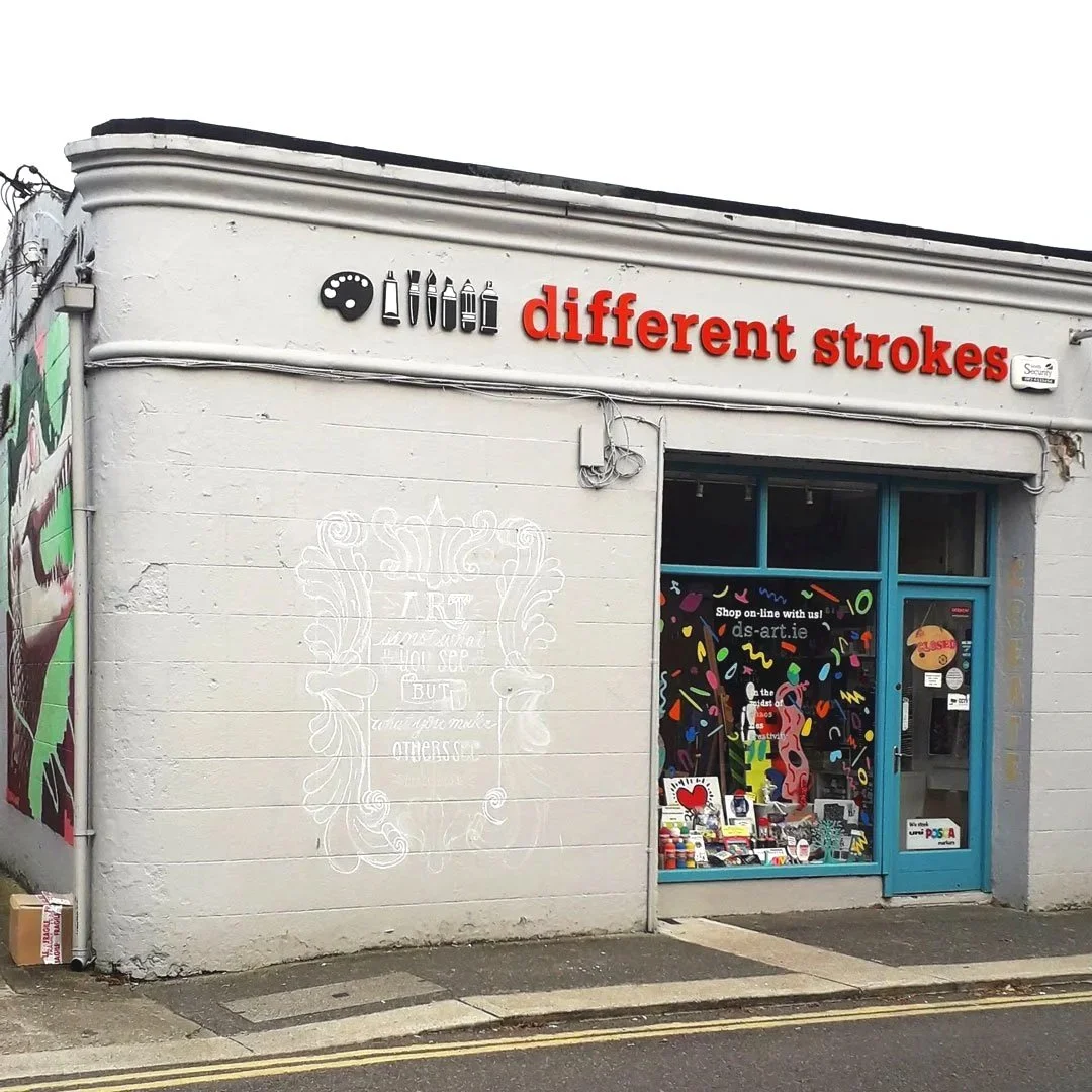 Mural sketch in chalk featuring a large-scale vintage frame surrounding a quote. Drawn on an art shopfront, Different Strokes, in Gorey, Co. Wexford, Ireland.
