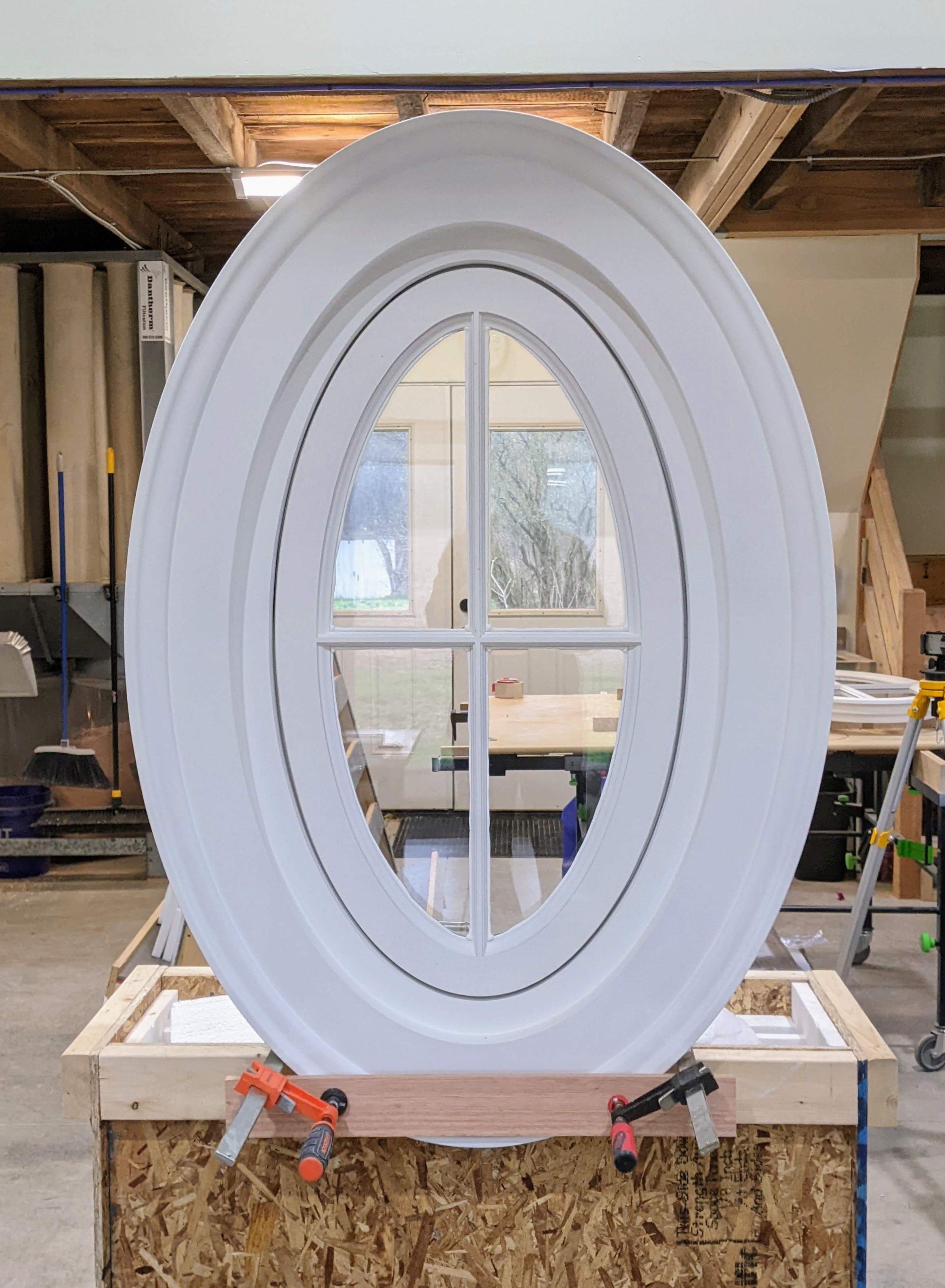 Custom oval window for historic inn