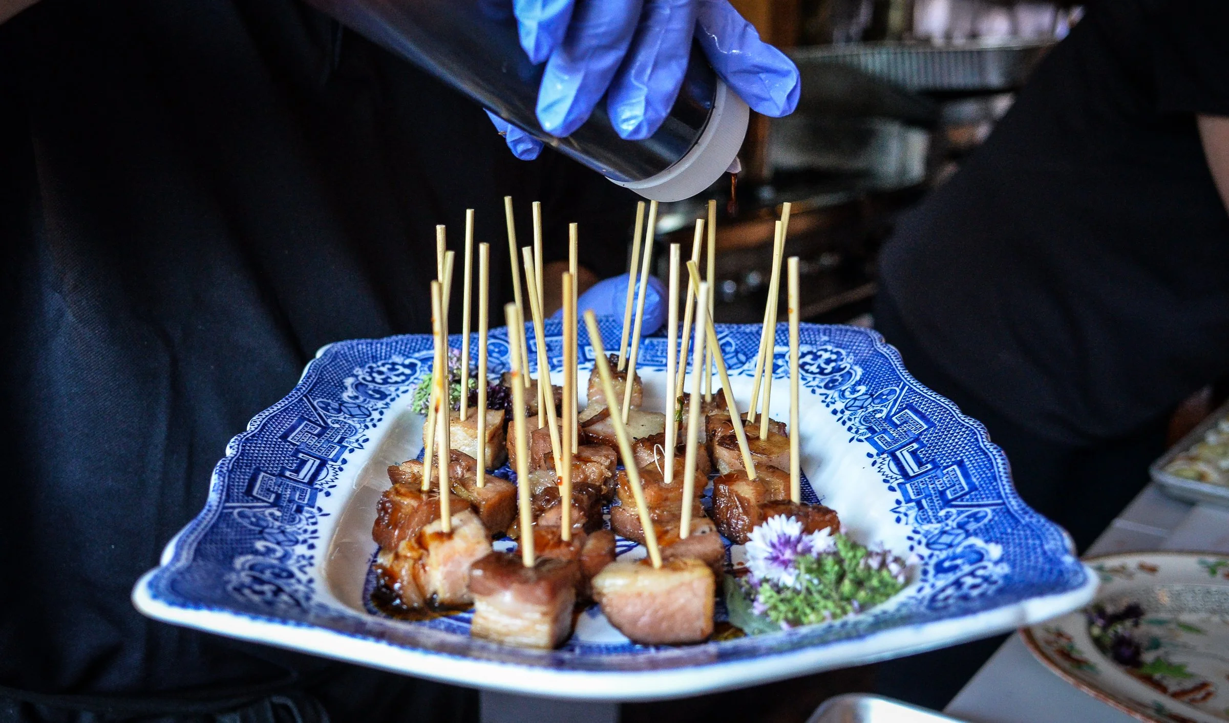 Smoked pork belly burnt ends skewers, catering appetizer