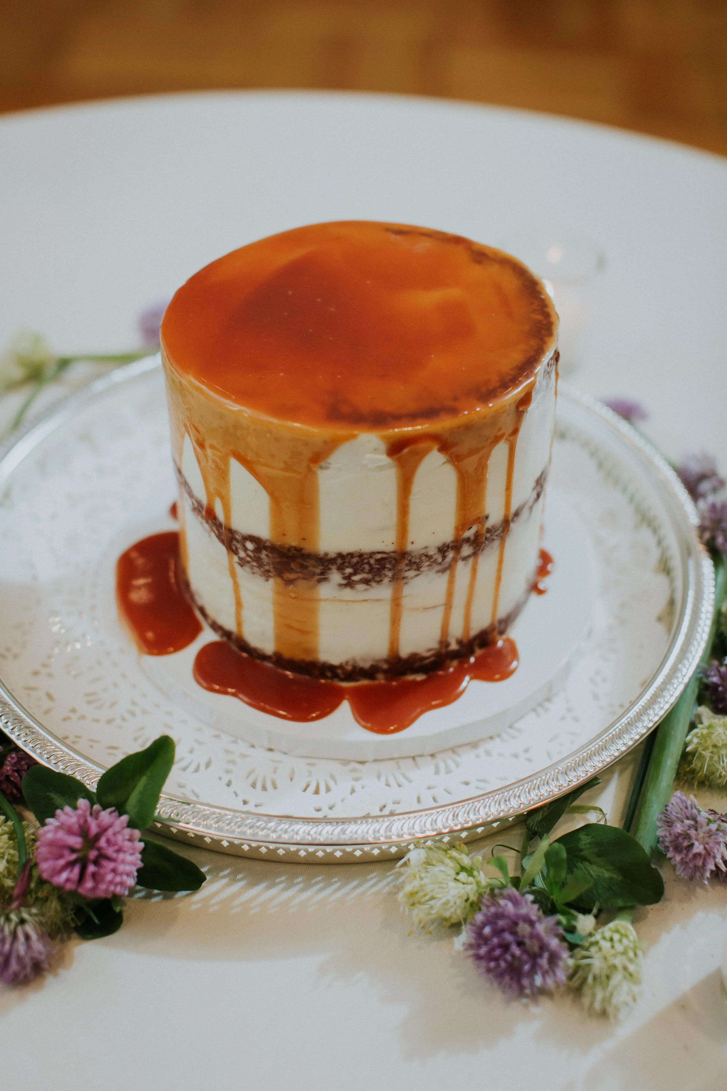 Custom wedding cake with caramel drizzle, catering dessert