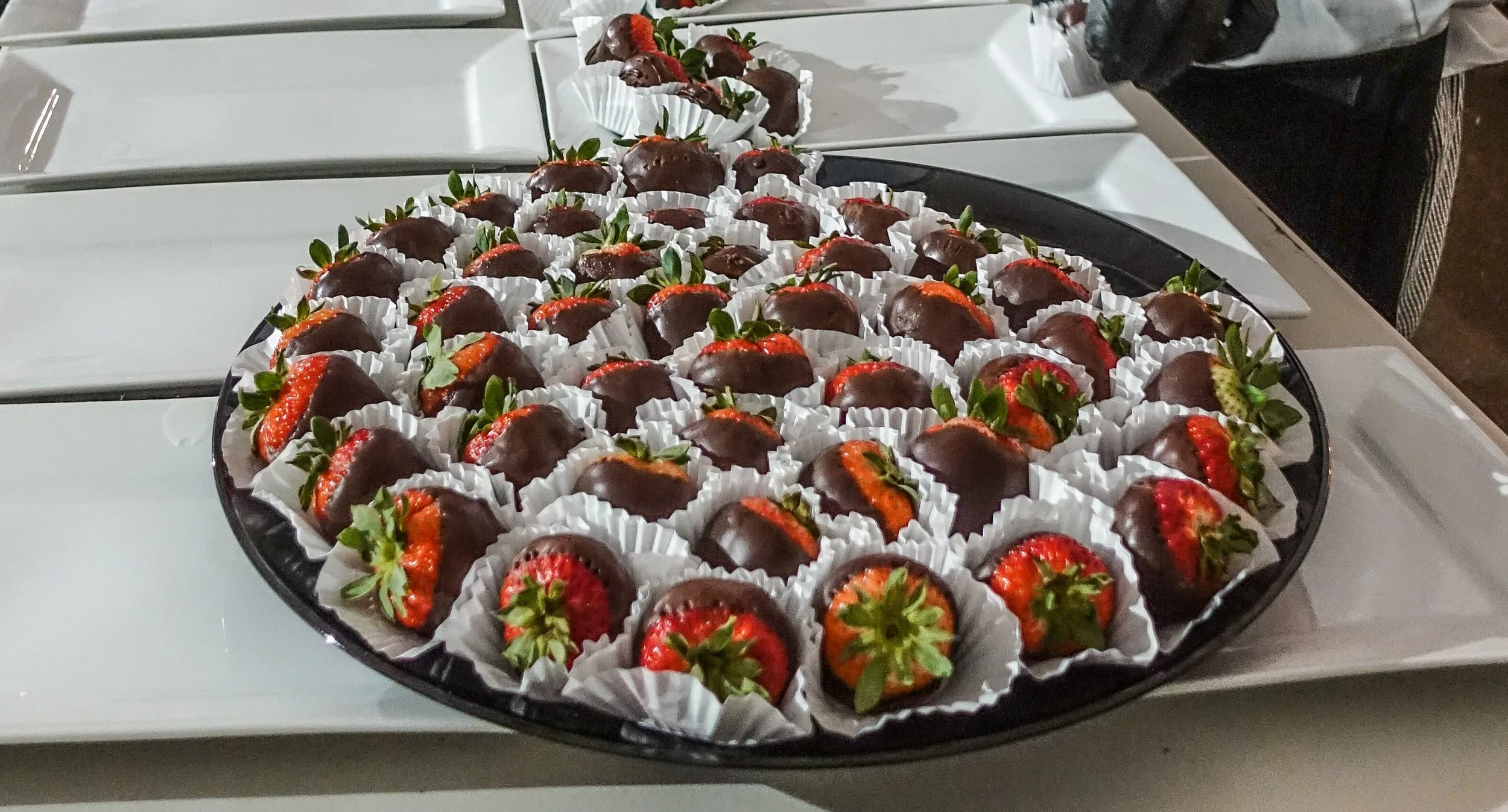 Chocolate-dipped strawberry dessert bites, wedding catering