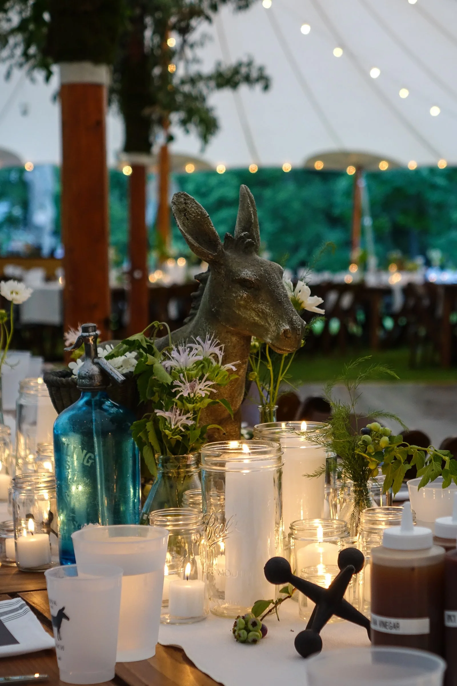 Thematic donkey decor accent at outdoor wedding