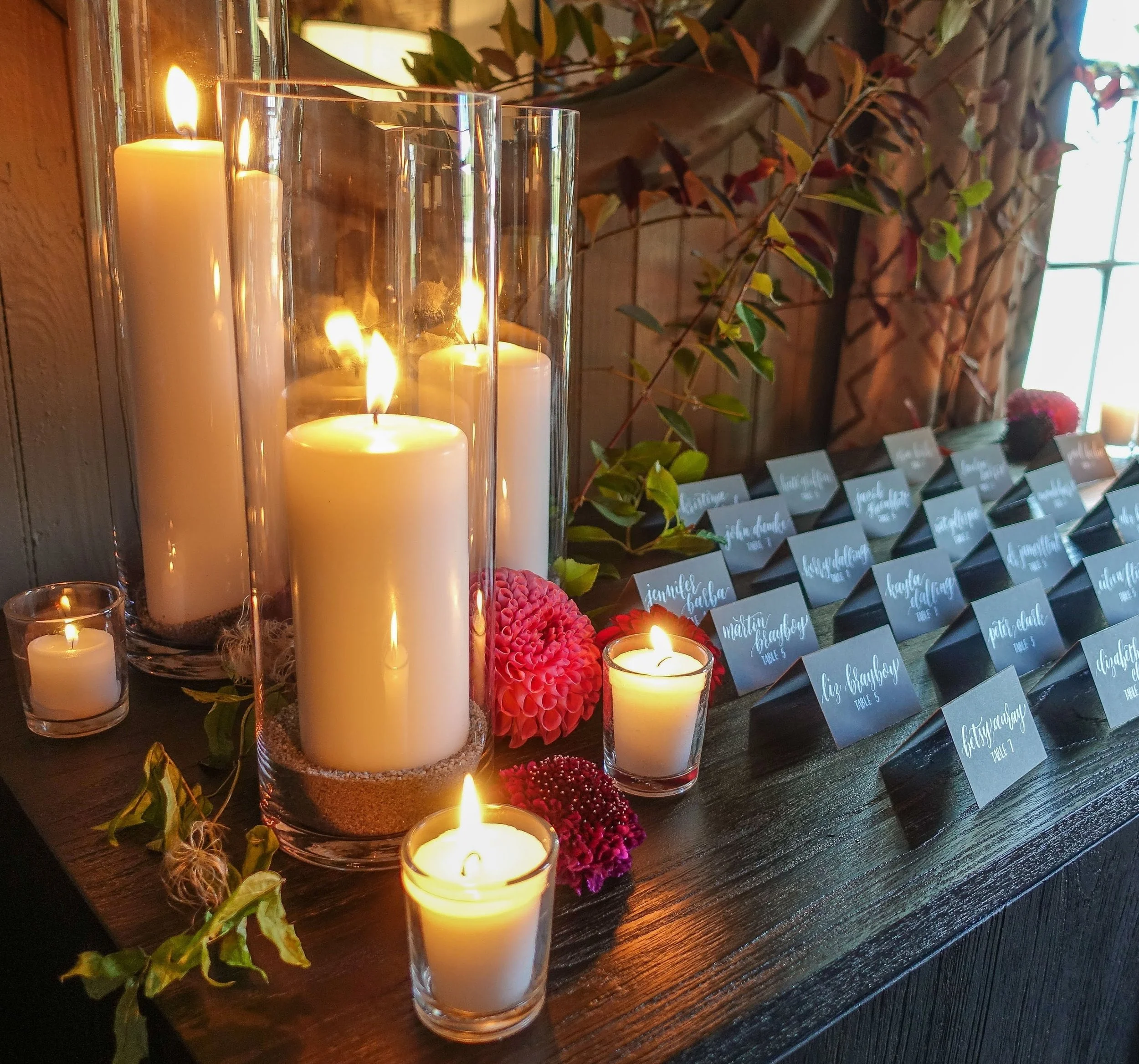 Large pillar candle centerpiece at wedding table