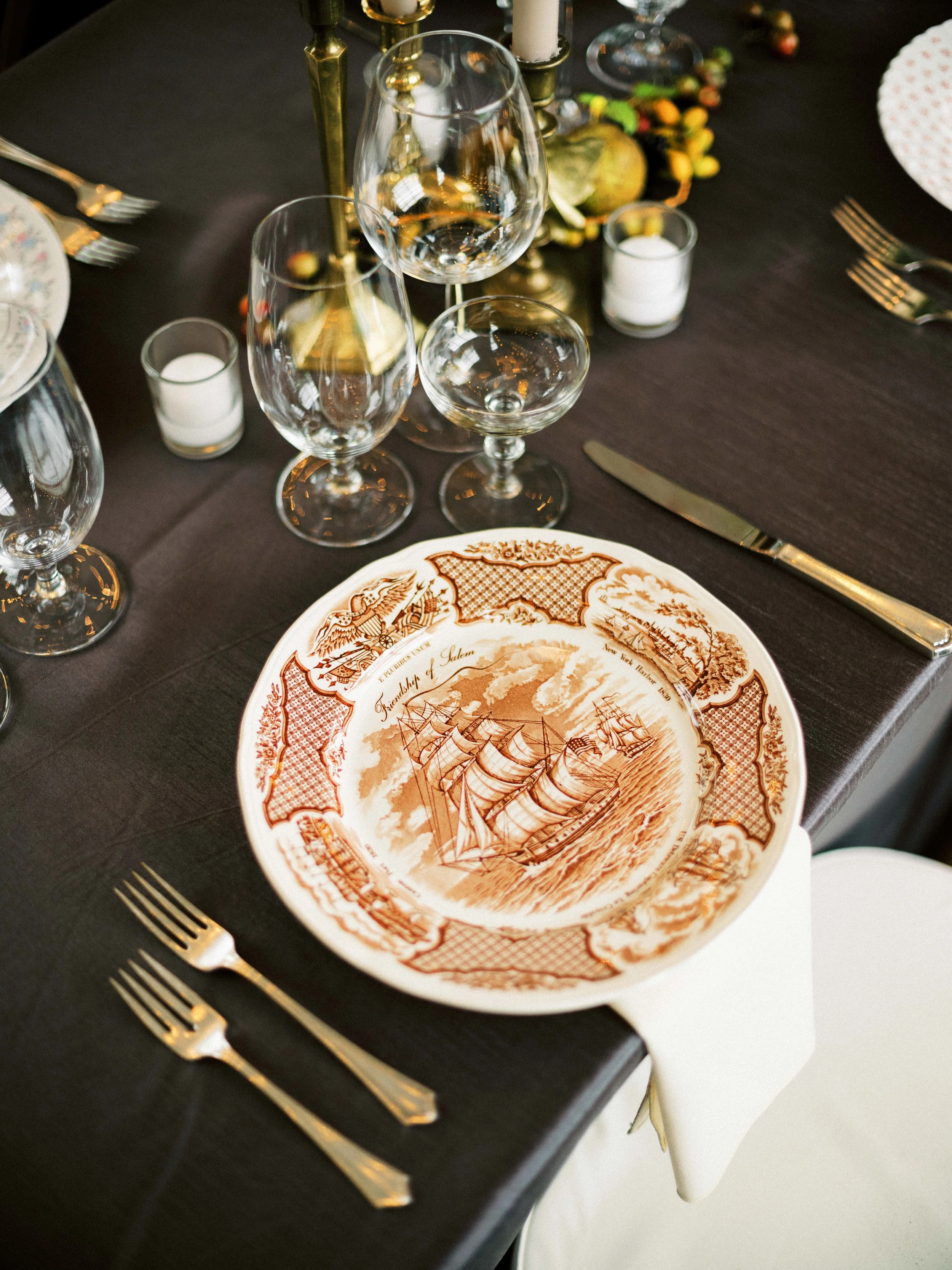 Decorative painted charger plate at wedding place setting