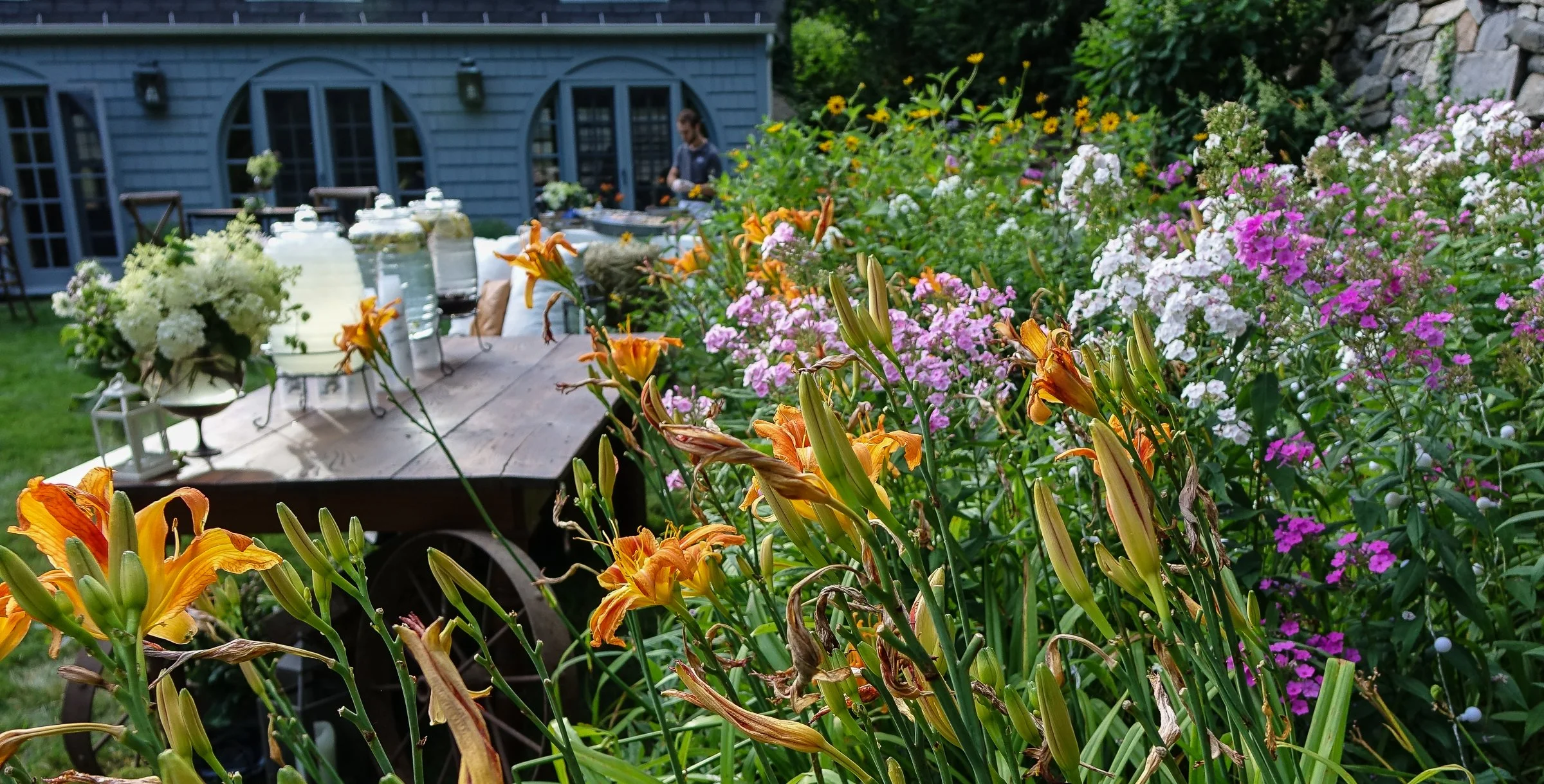 Wedding garden bar surrounded by blooming flowers