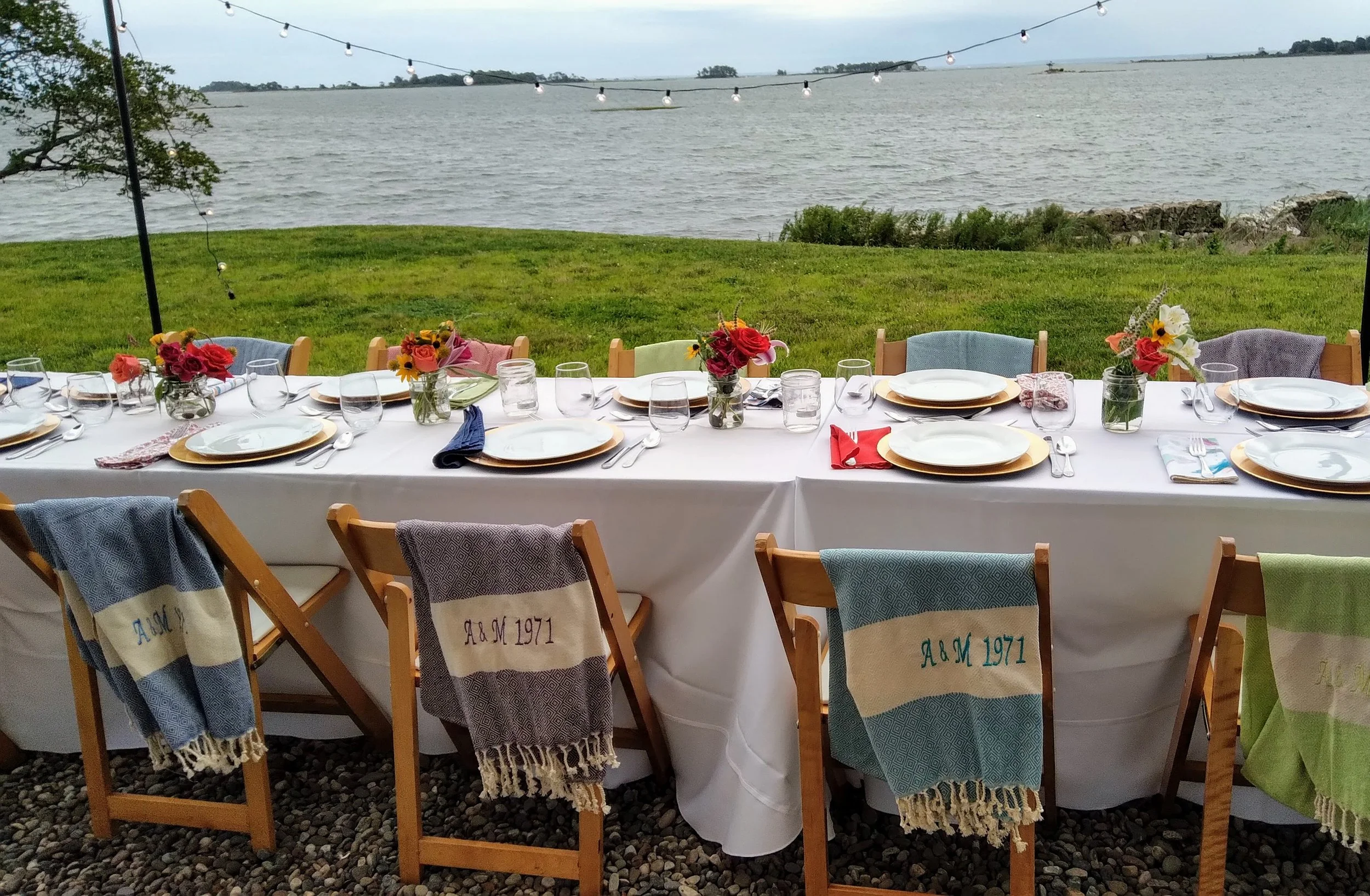 Private waterfront event dinner setting