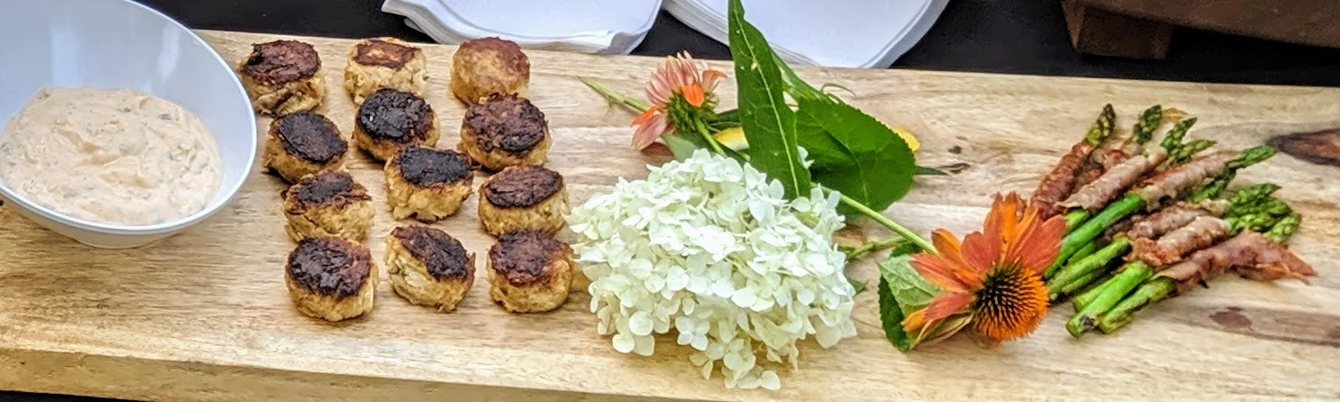 Crabcake and prosciutto-wrapped asparagus bites for wedding bridal party