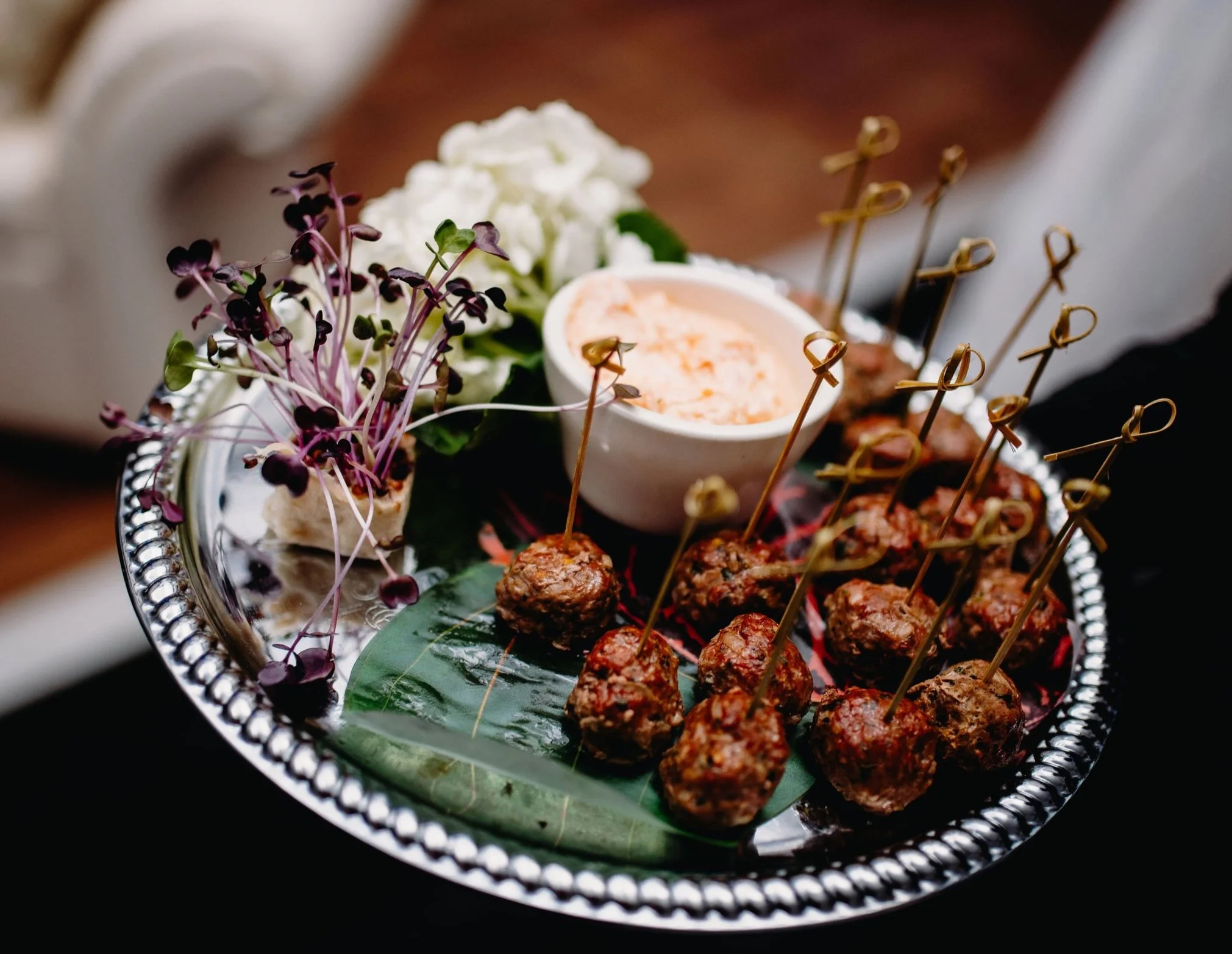 Lamb kofta lollipop appetizers with harissa yoghurt dip