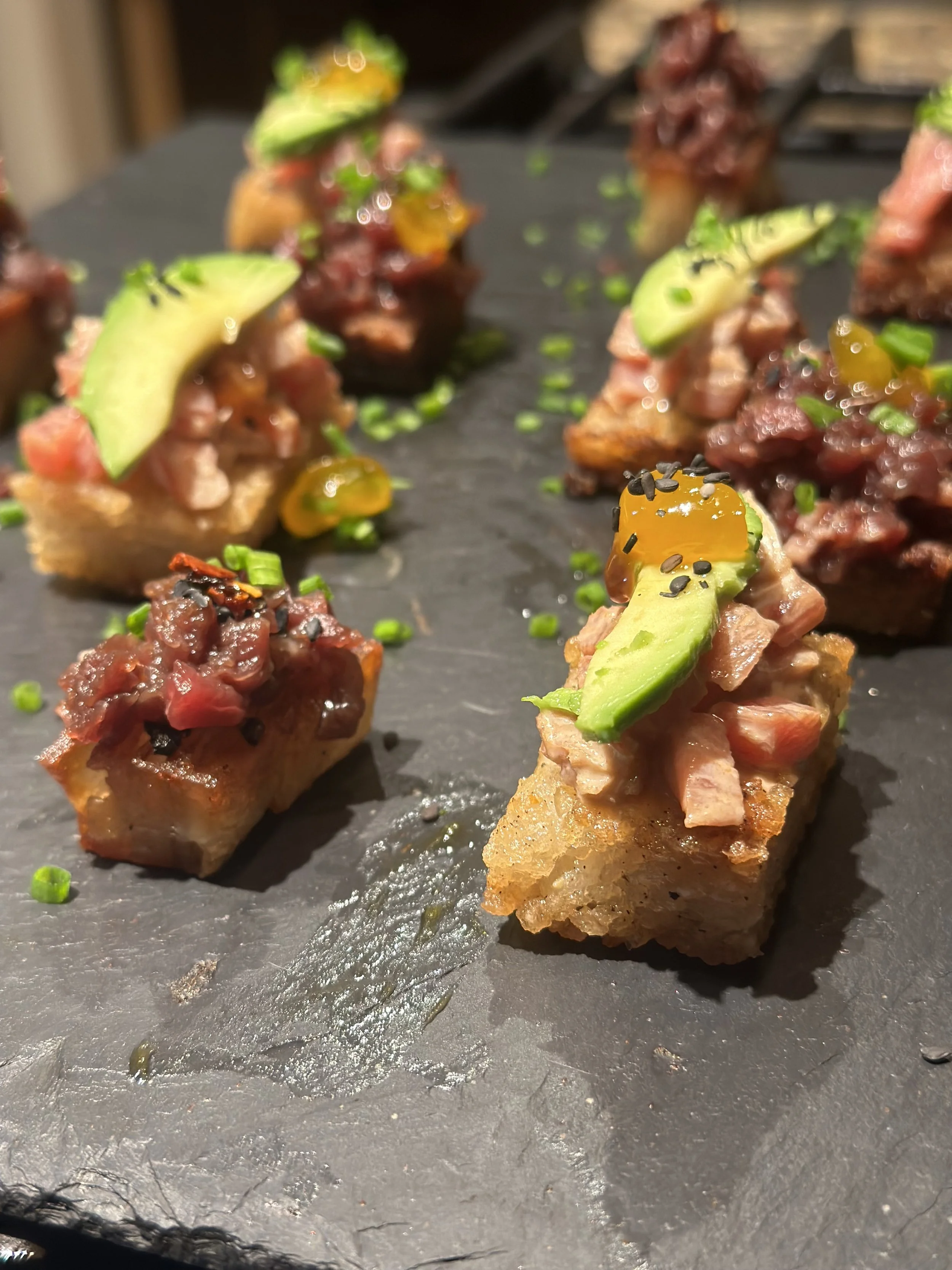 Spicy tuna crispy rice bites with avocado, catering appetizer