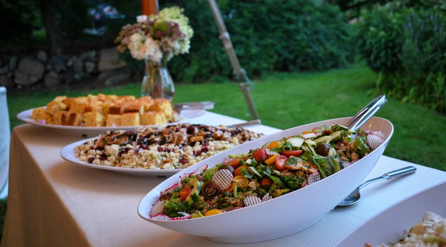Buffet plates set up in a table by Odeen's Catering
