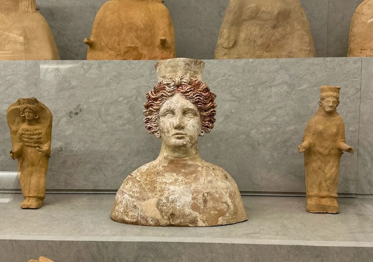 Ancient sculptures of Tanit and other female figures displayed in the Necropolis of Puig des Molins in Ibiza.
