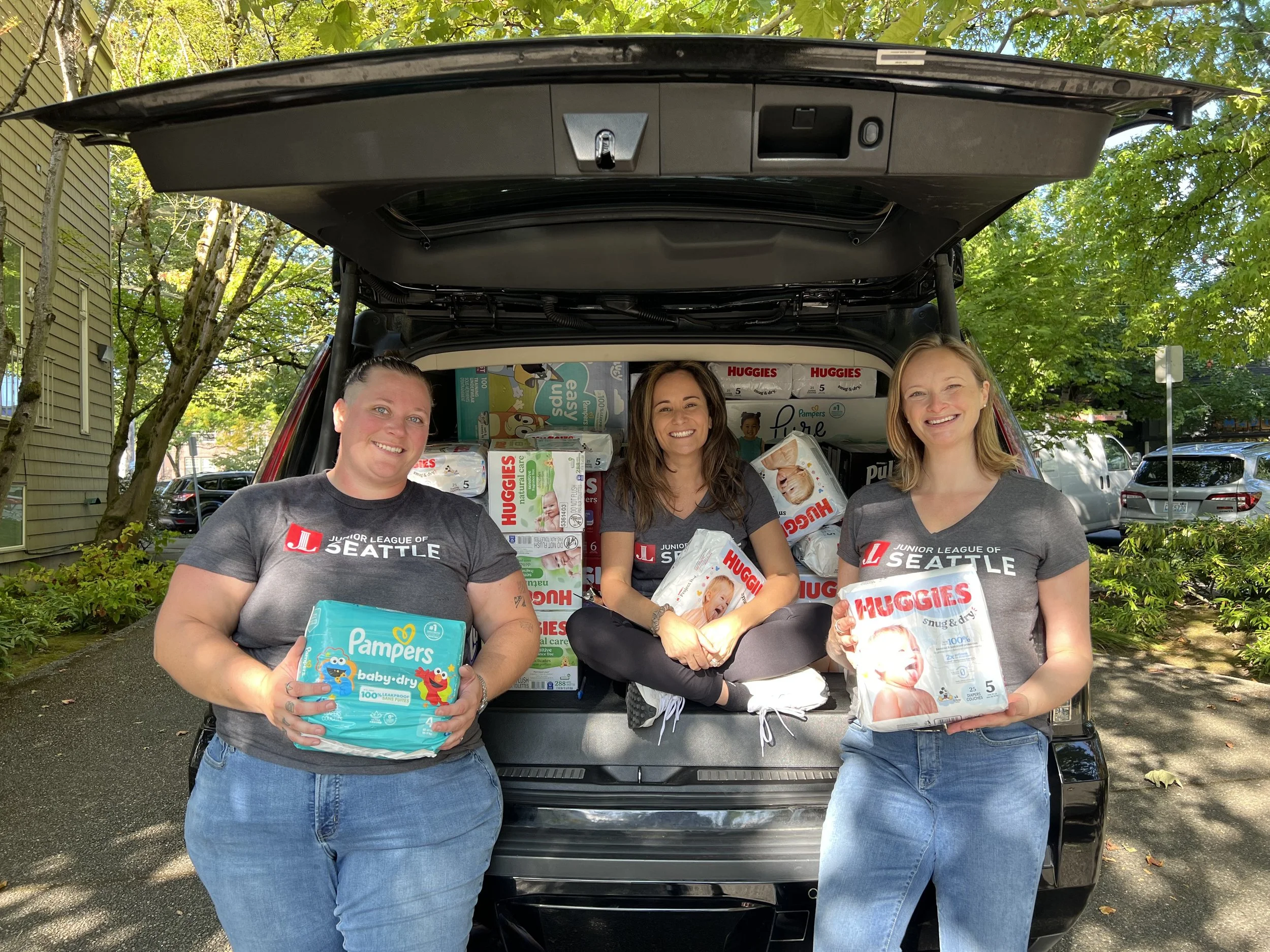 Volunteers helping process donations for the community