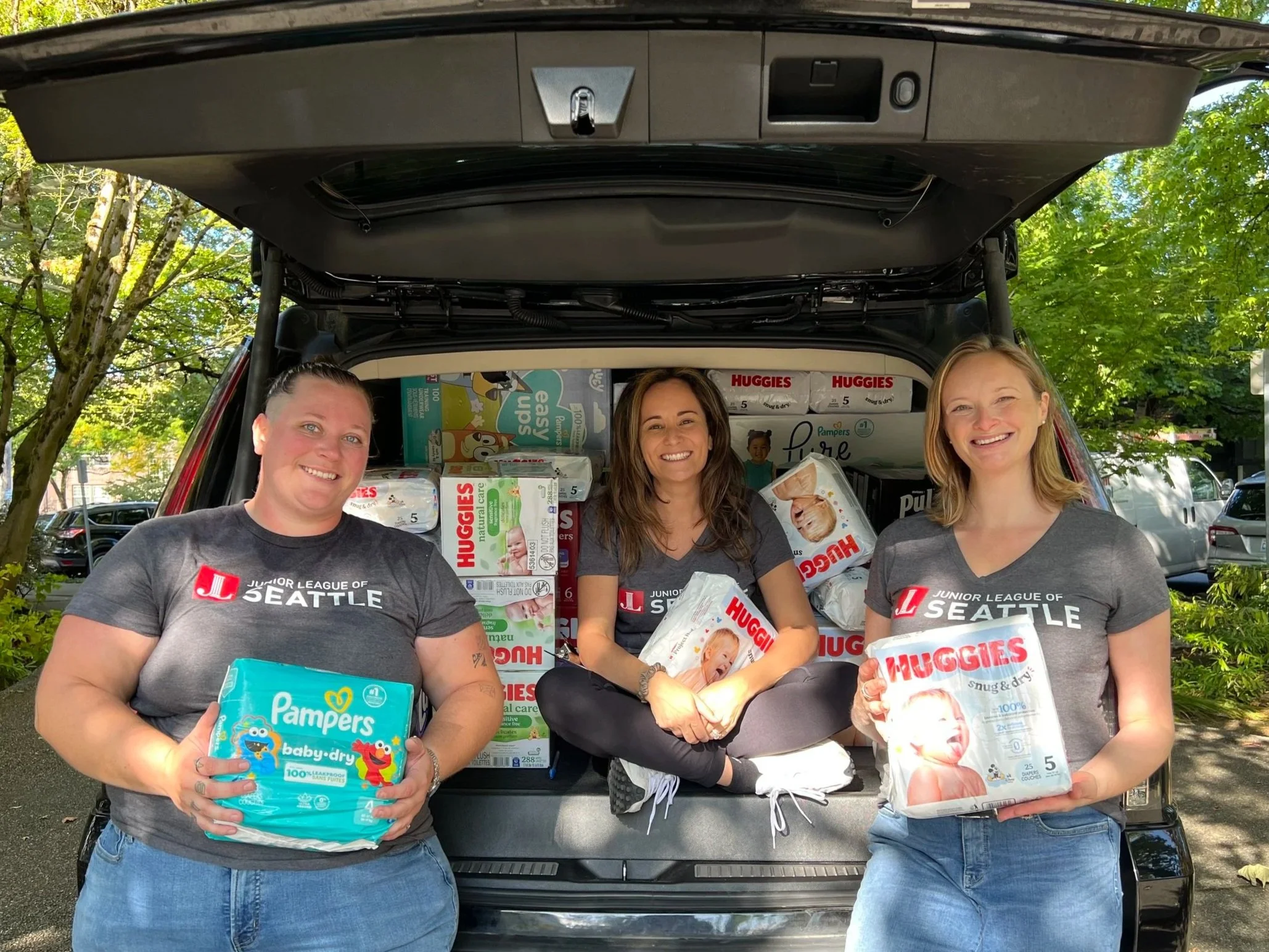 female volunteers of diverse backgrounds coming together to volunteer and make a difference in our seattle community