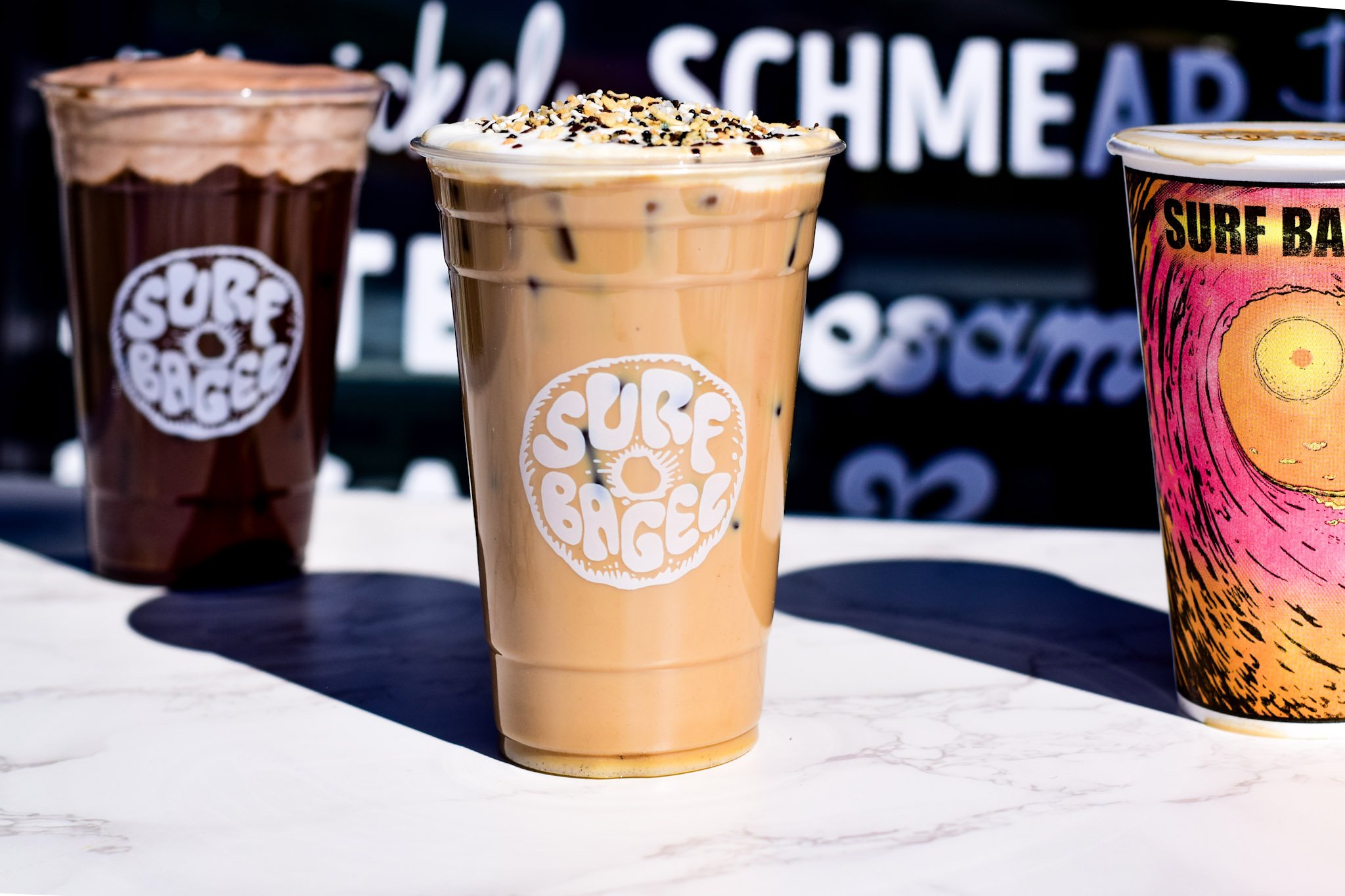 Three Surf Bagel Specialty drinks including Surf Bagel Latte, Double Trouble, and Hot Coffee