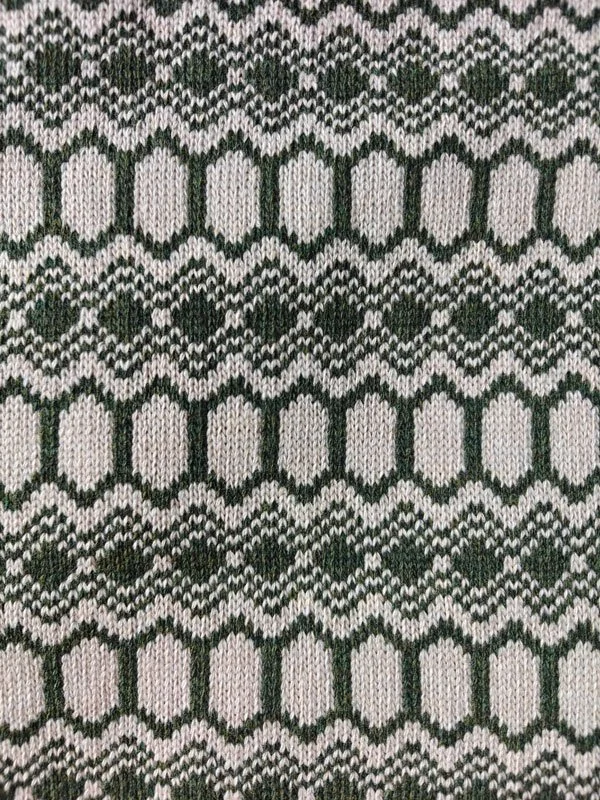 Strandhill wool snood swatch showing the moss green and light stone colourway and pattern repeat,