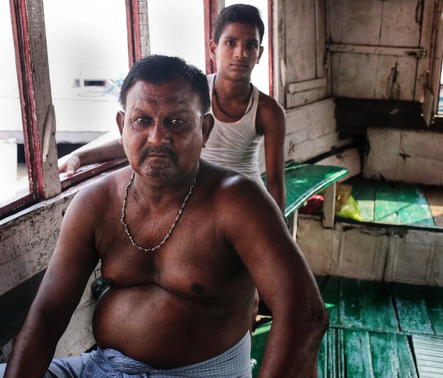 Boat captain and his son in Varanasi, India