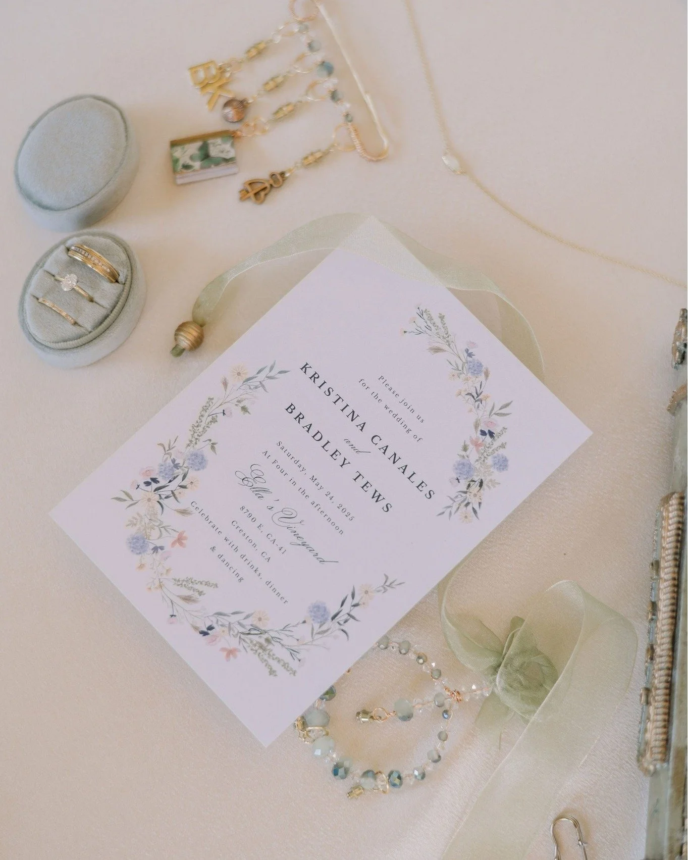 White florals and touches of green and gold delicately decorated Kristina &amp; Bradley's beautiful oak tree wedding at @ellasvineyardweddings. Their ceremony benches were set with sandalwood hand fans and paper umbrellas to help guests manage the da