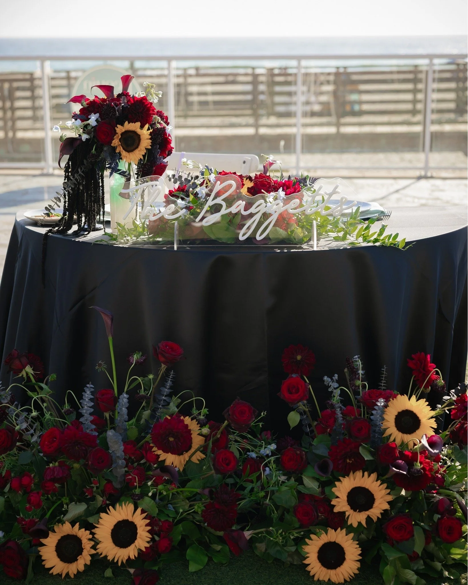 Take a look at Corrie &amp; Brandon's goth seaside wedding reception. The combination of gothic and beach elements was absolutely striking and created something personal and unique. I love the inclusion of seashells in the place cards and florals. Th