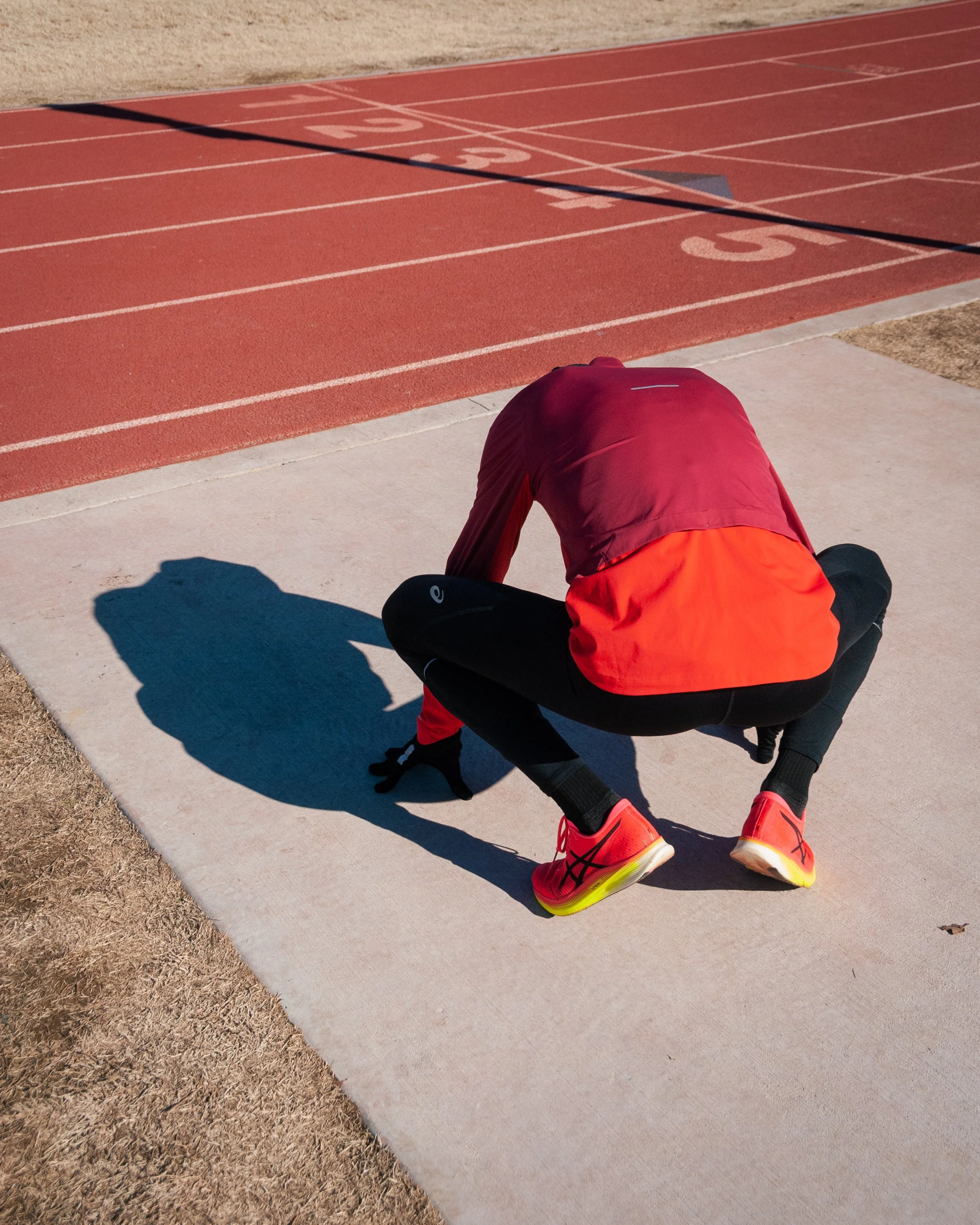 Ben stretches his hips after calling a workout due to hip and hamstring tightness. 