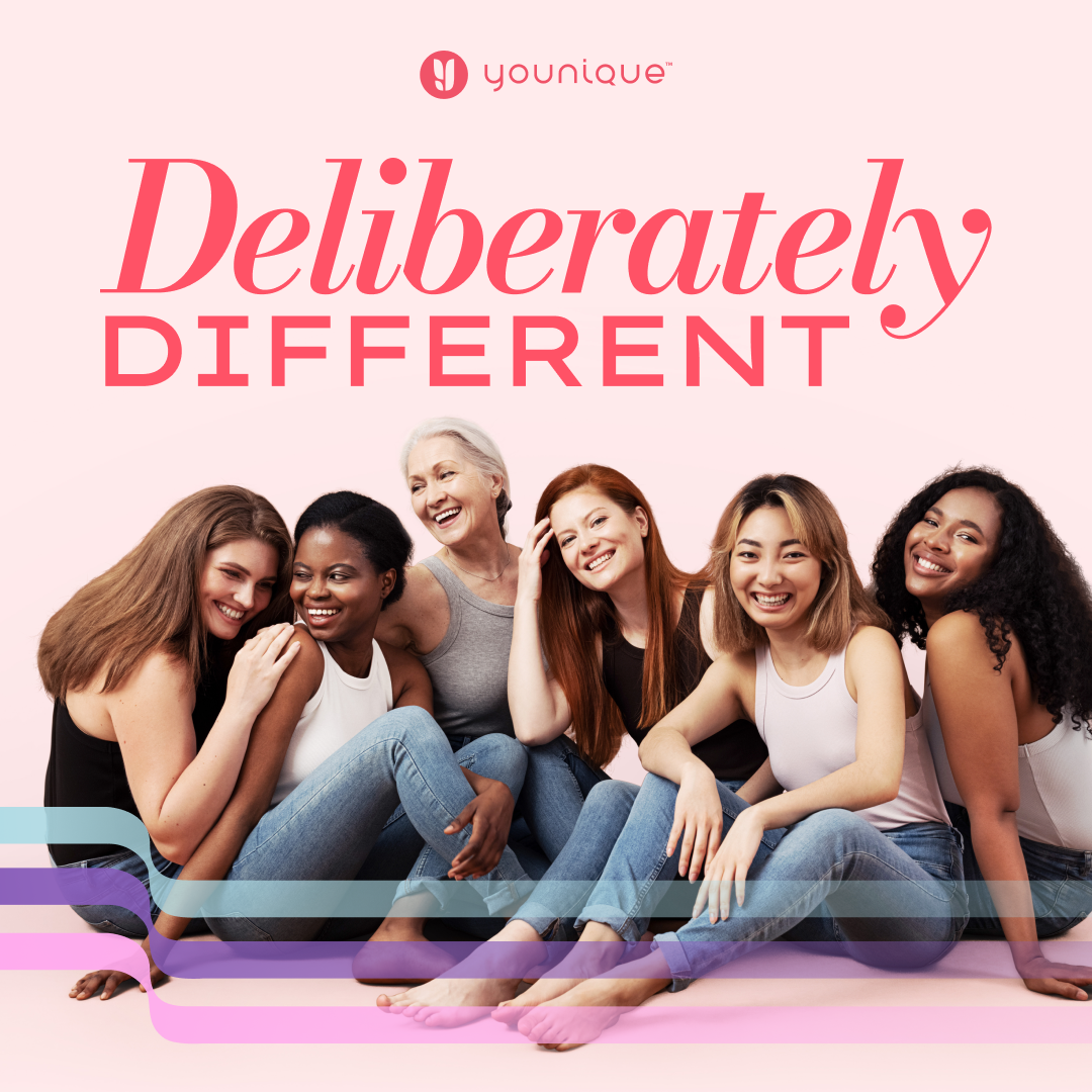 Group of diverse women sitting together, smiling, with the text "Deliberately Different" above them, and the Younique logo at the top.