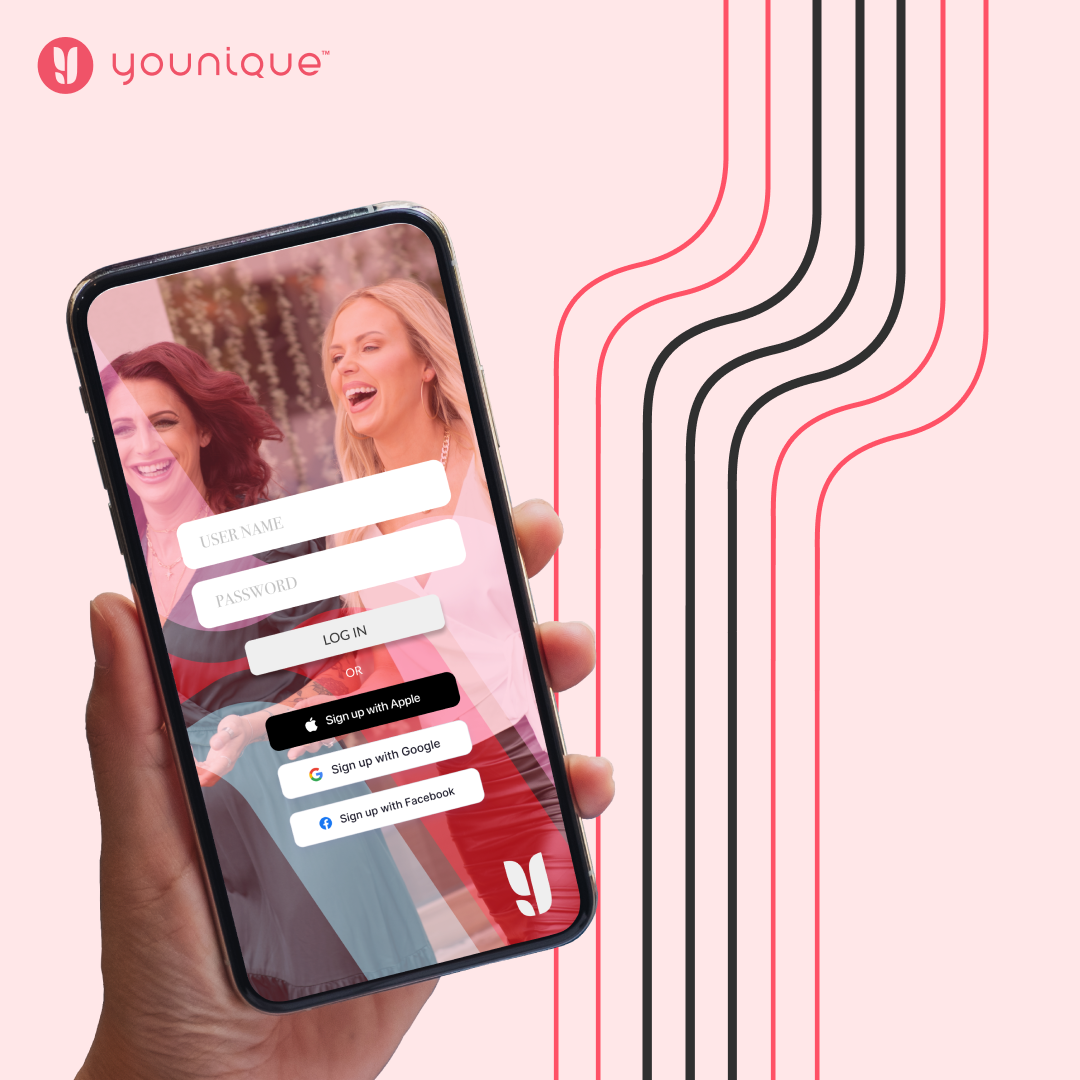A smartphone held in hand displaying a login screen for a social app called Younique, with a background image of two women smiling and laughing, set against a pink background with black and pink curved lines.