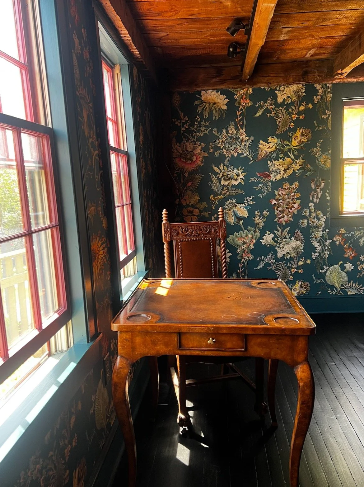 When the wallpaper goes up, the room is really coming together! 
Still waiting on the new rug, chandelier and upholstery fabric to be installed. 
I love how the rose window mullions play with the wallpaper flowers.
A wildly fun project, where I've ha