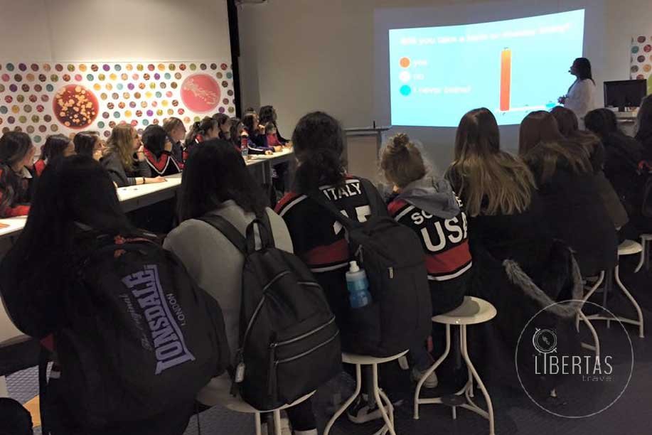A group lecture underway for a group of young Australian high school students wearing their senior school uniforms