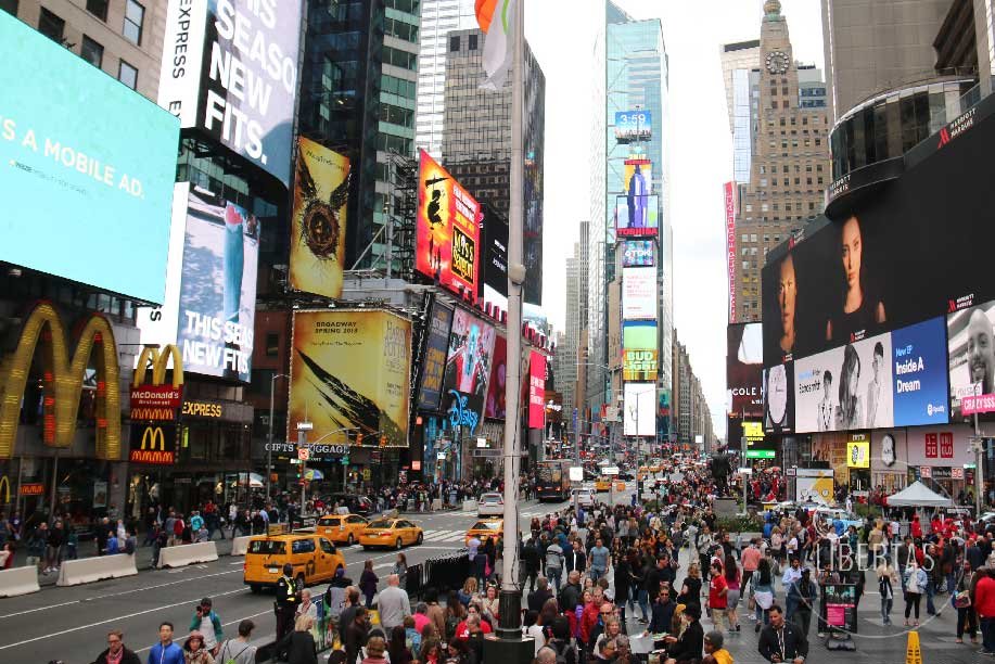 Bustling New York City street with a myriad of shopping, shows and restaurants