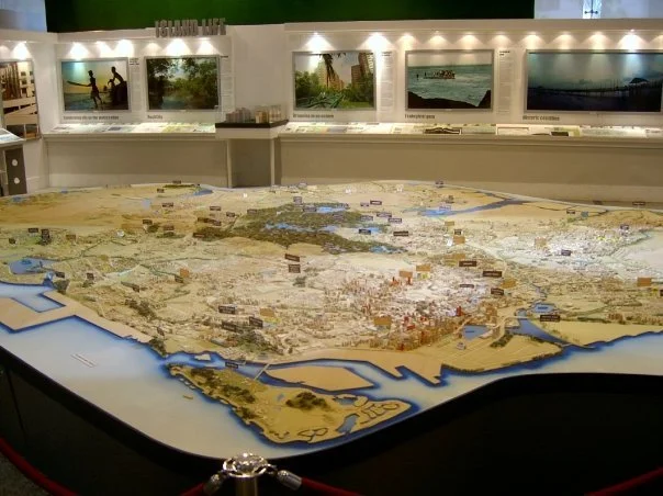 A detailed model at the City Gallery reveals decades of urban planning and land reclamation — hands-on learning in action. (