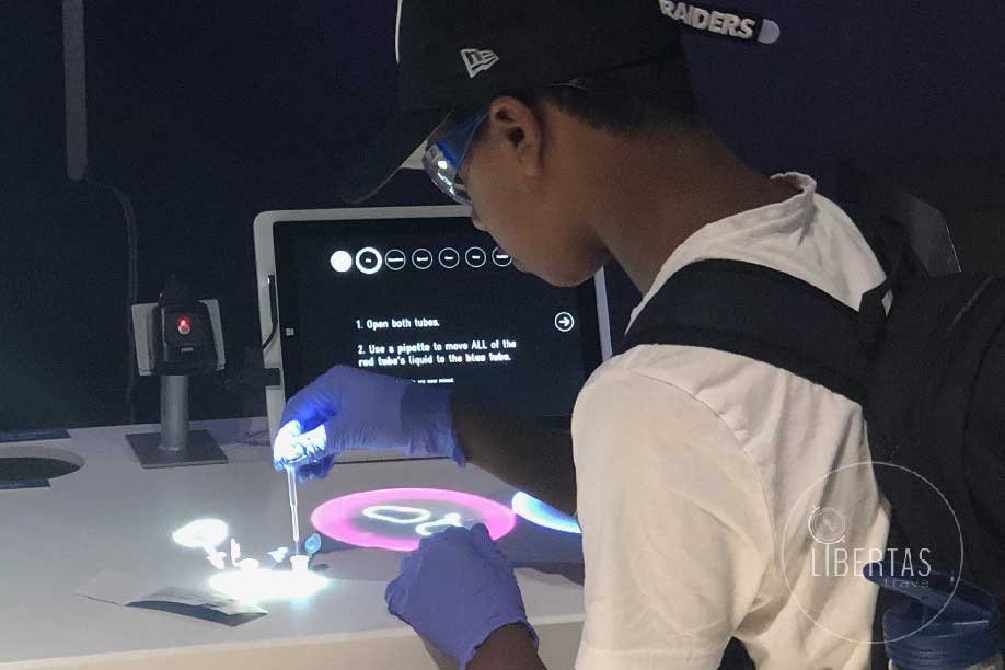 Tech museum San Francisco young male student interacting with a technology exhibit