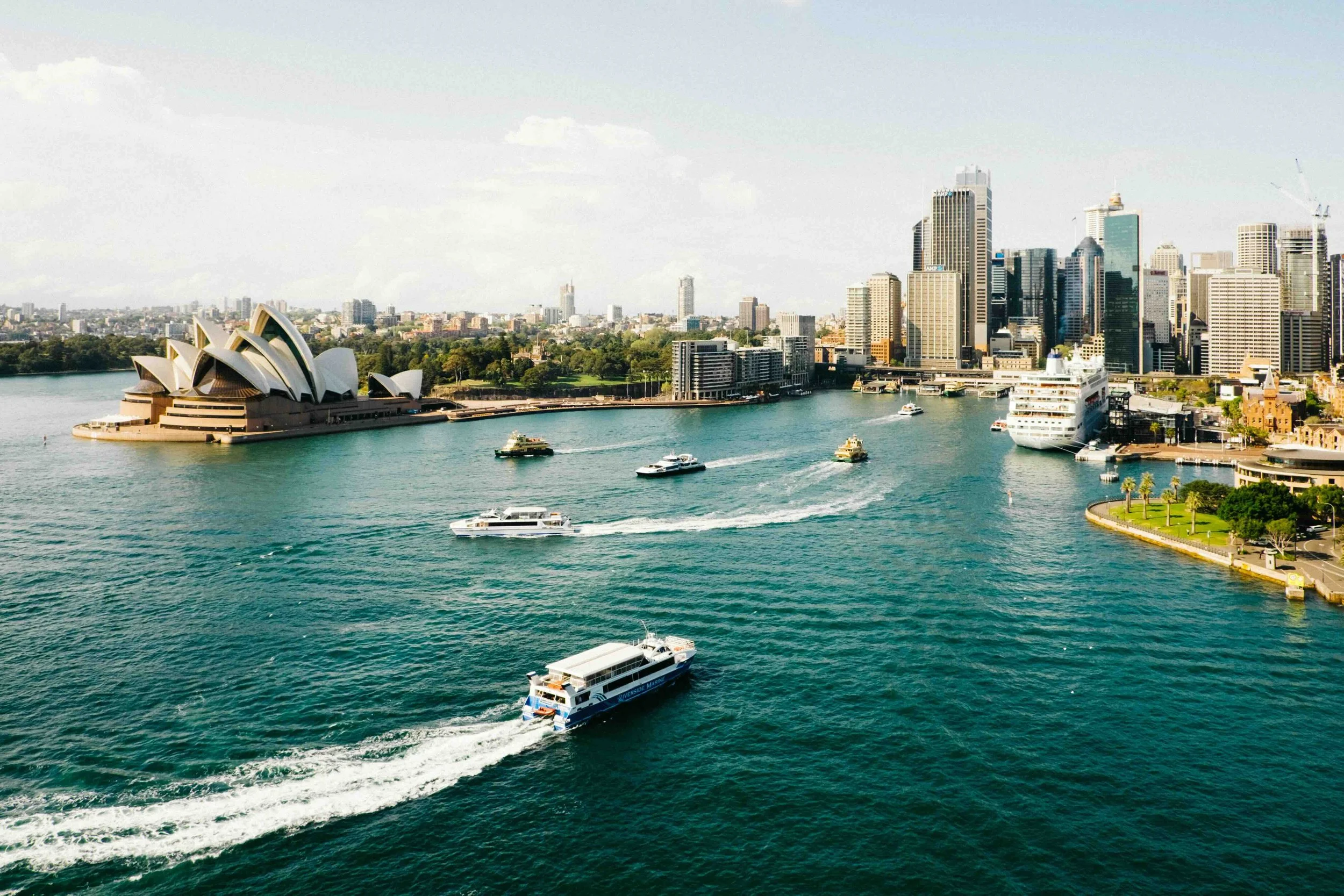 Aerial view of Sydney Harbour with the Opera House and CBD skyline — the gateway to Libertas Travel's bespoke Australian high school excursions and domestic student tours.