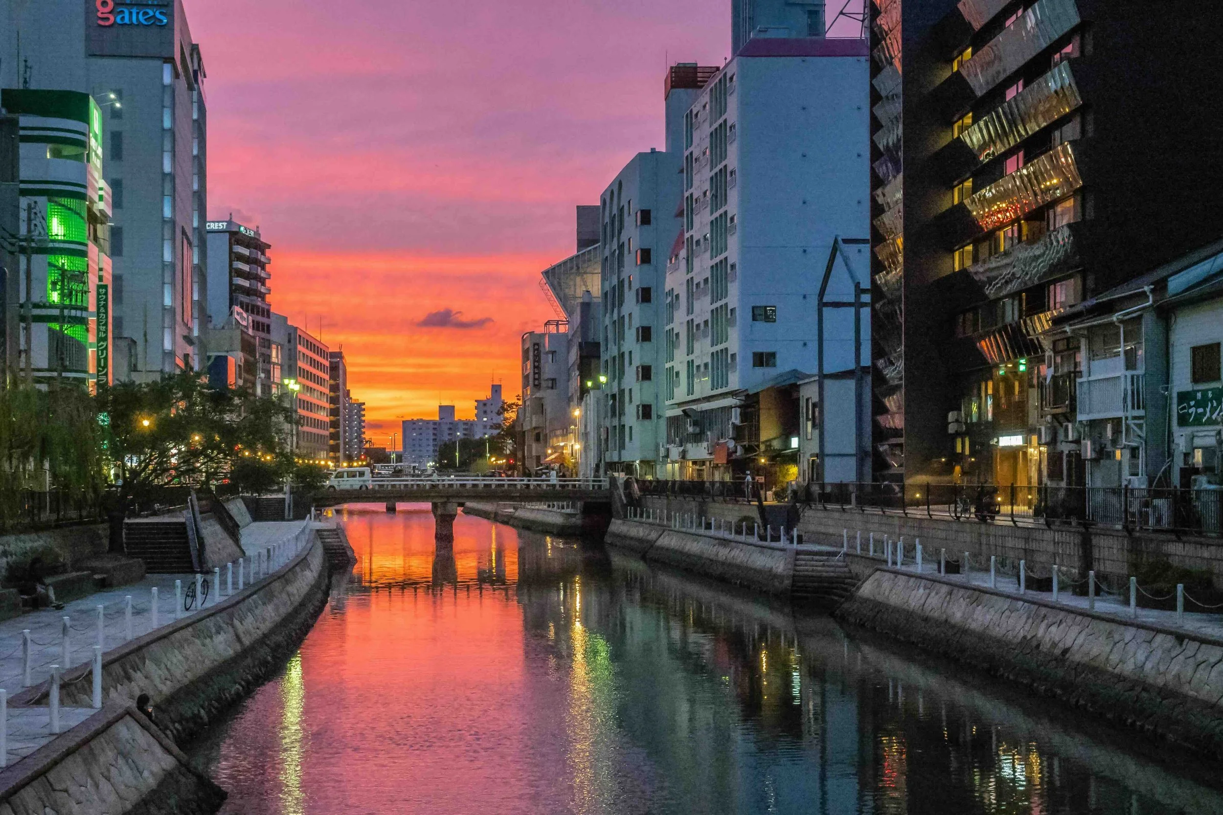 river between high rise buildings during night time Naka River, Fukuoka, Japan