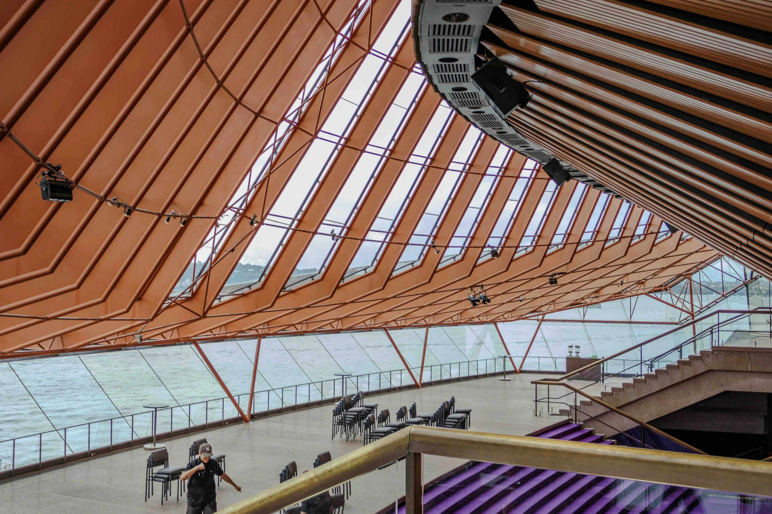 The soaring terracotta-ribbed interior of the Sydney Opera House overlooking Sydney Harbour — an architectural and performing arts landmark visited on Libertas Travel's Sydney high school excursions.