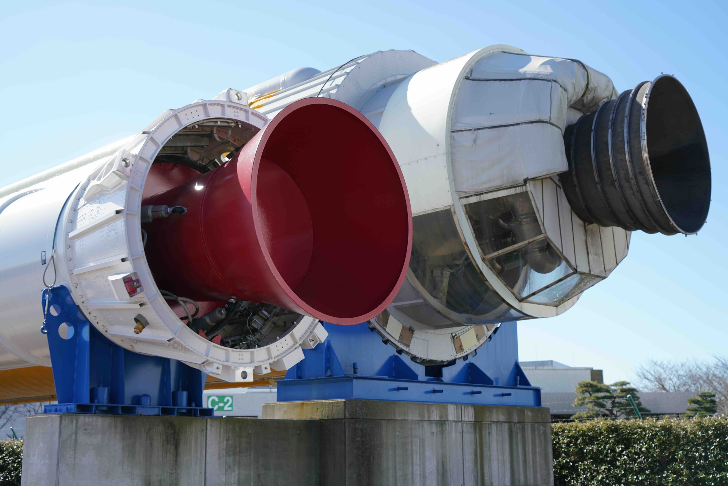 2 | Day 4, Tsukuba | Close-up of a rocket engine on display — JAXA Tsukuba Space Center visit, astronaut training and mission control hub.