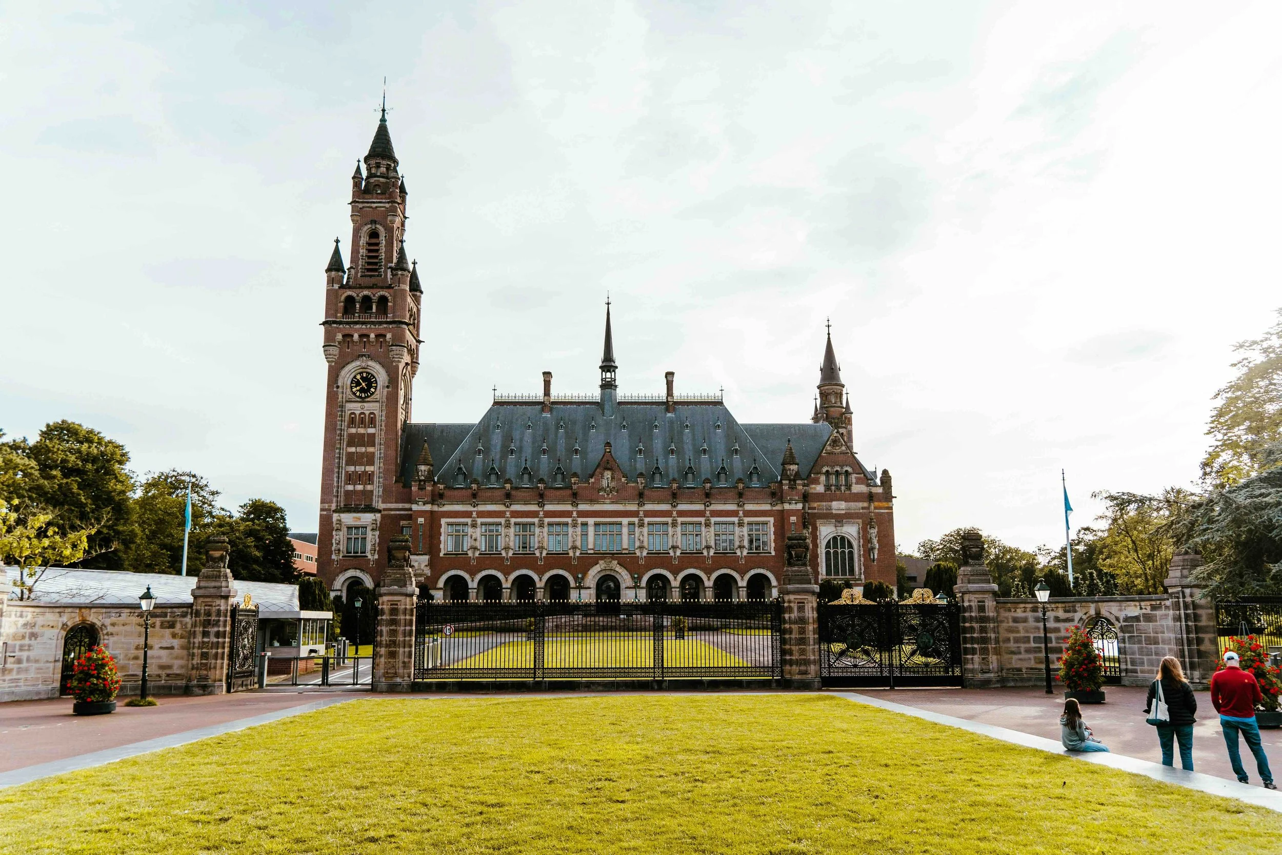 The Hague, Netherlands | The Peace Palace (Vredespaleis), seat of the International Court of Justice, viewed from the front gates across the lawn.