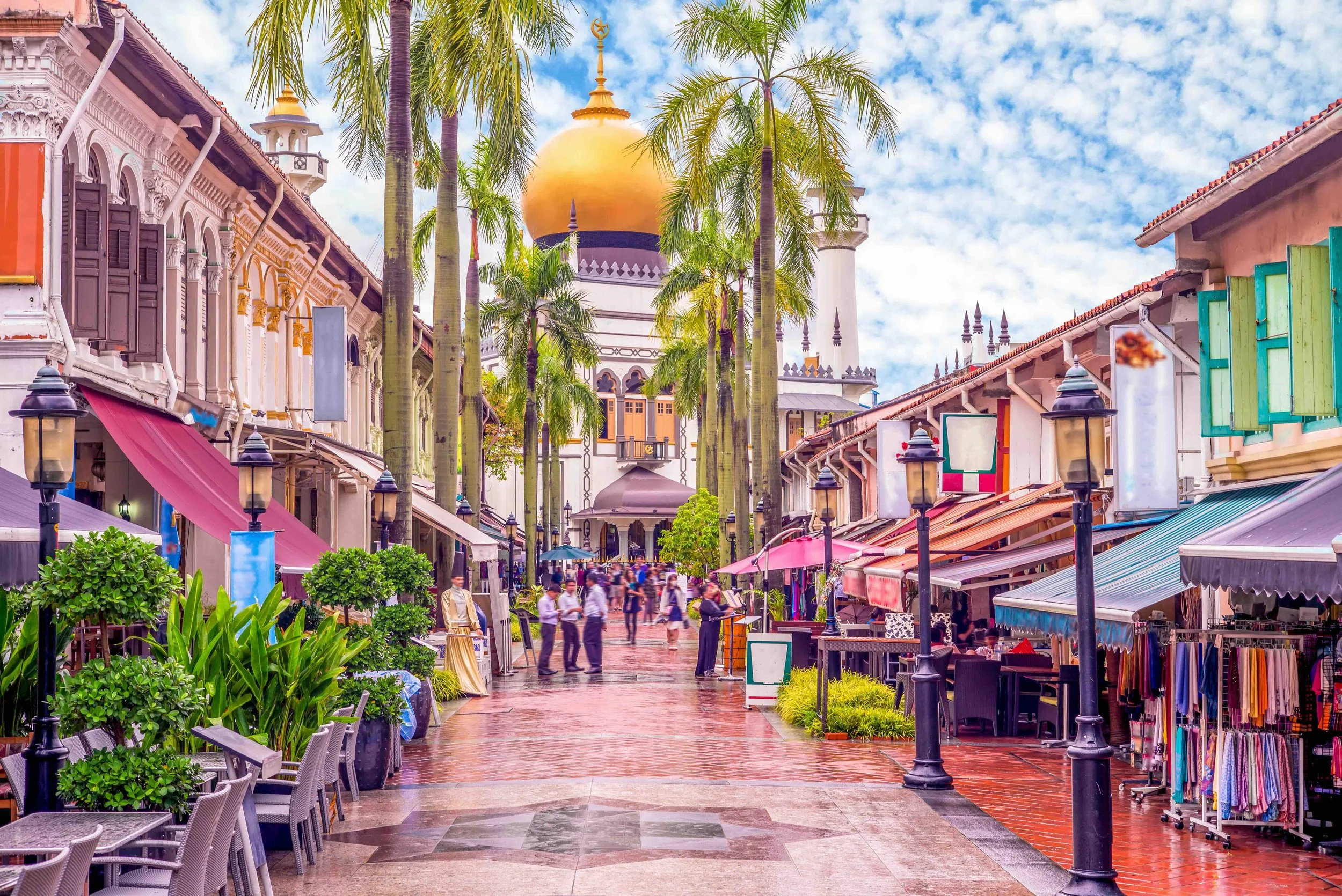 Vibrant shopfronts lead to the golden dome of Sultan Mosque in Kampong Glam, Singapore's historic Malay and Arab trading quarter — bringing migration and cultural history to life.
