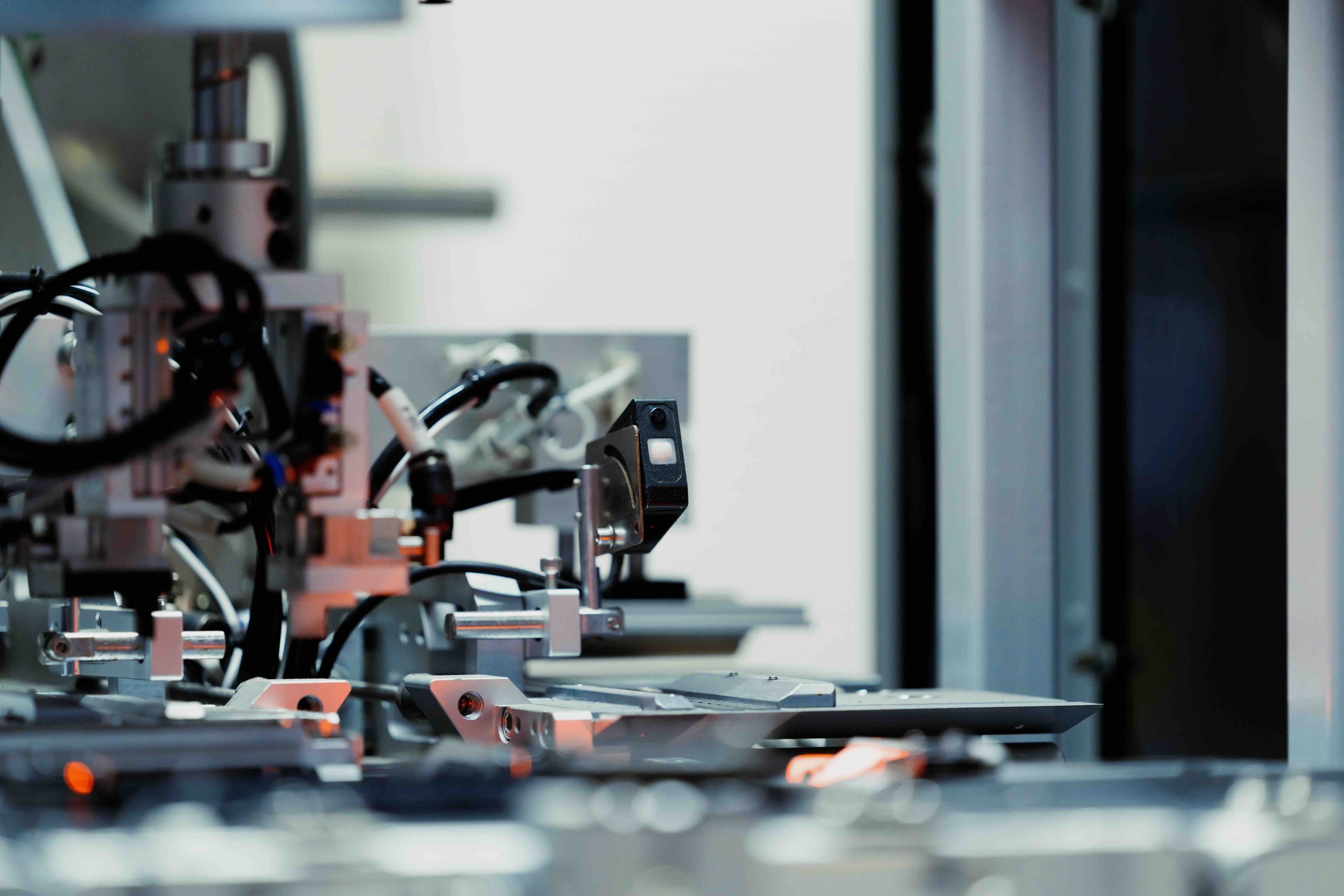 3 | Day 2, Tokyo | Precision robotic arm on an automated production line — Kawasaki Robospace, exploring industrial automation and AI applications.